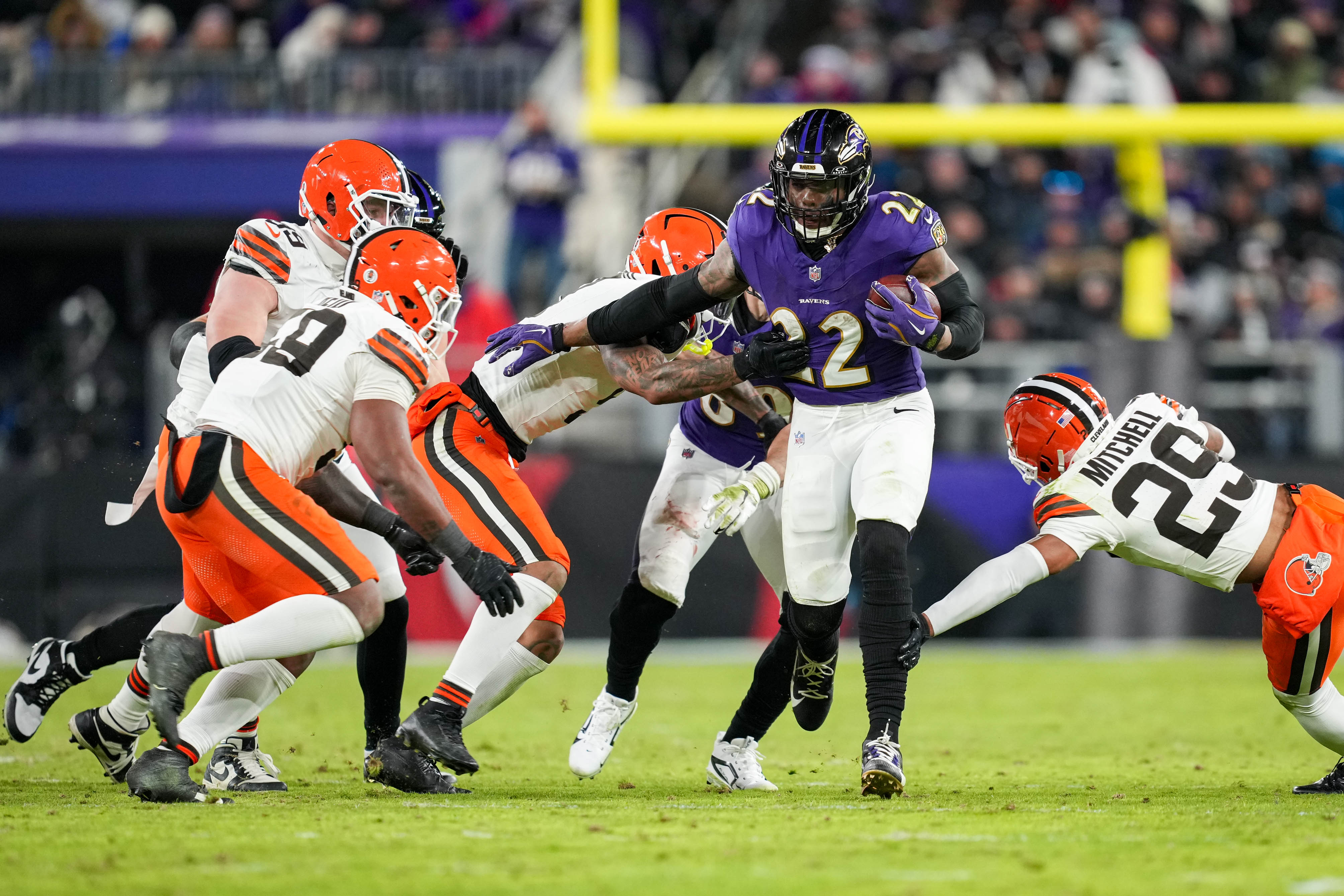 Ravens running back Derrick Henry breaks tackles as he rushes against the Cleveland Browns in Week 18 of the 2024 season.