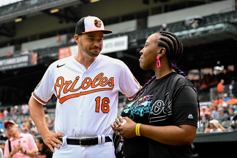 Orioles' Trey Mancini talks with Sonsy Gaba, mother of the late Baltimore super fan Mo Gaba, prior to the game on Mo Gaba Day on July 28, 2022.