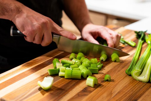 Matt Newman demonstrates his sharpened knives in action in his home on November 22, 2023.