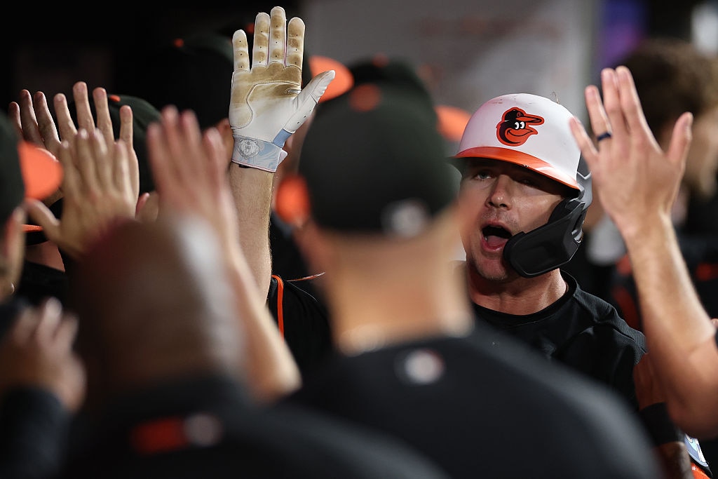 Orioles first baseman Pete Alonso celebrates his go-ahead two-run home run in the dugout with teammates in the seventh inning.