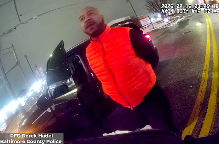 The Maryland Attorney General’s Office released body camera footage showing Samuel “Big Sam” Brown Jr.’s swatting away Baltimore County Police Officer Derek Hadel’s arm twice before he punches Brown twice — knocking him into the asphalt.