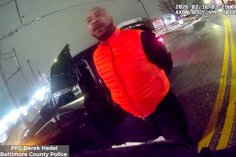 The Maryland Attorney General’s Office released body camera footage showing Samuel “Big Sam” Brown Jr.’s swatting away Baltimore County Police Officer Derek Hadel’s arm twice before he punches Brown twice — knocking him into the asphalt.