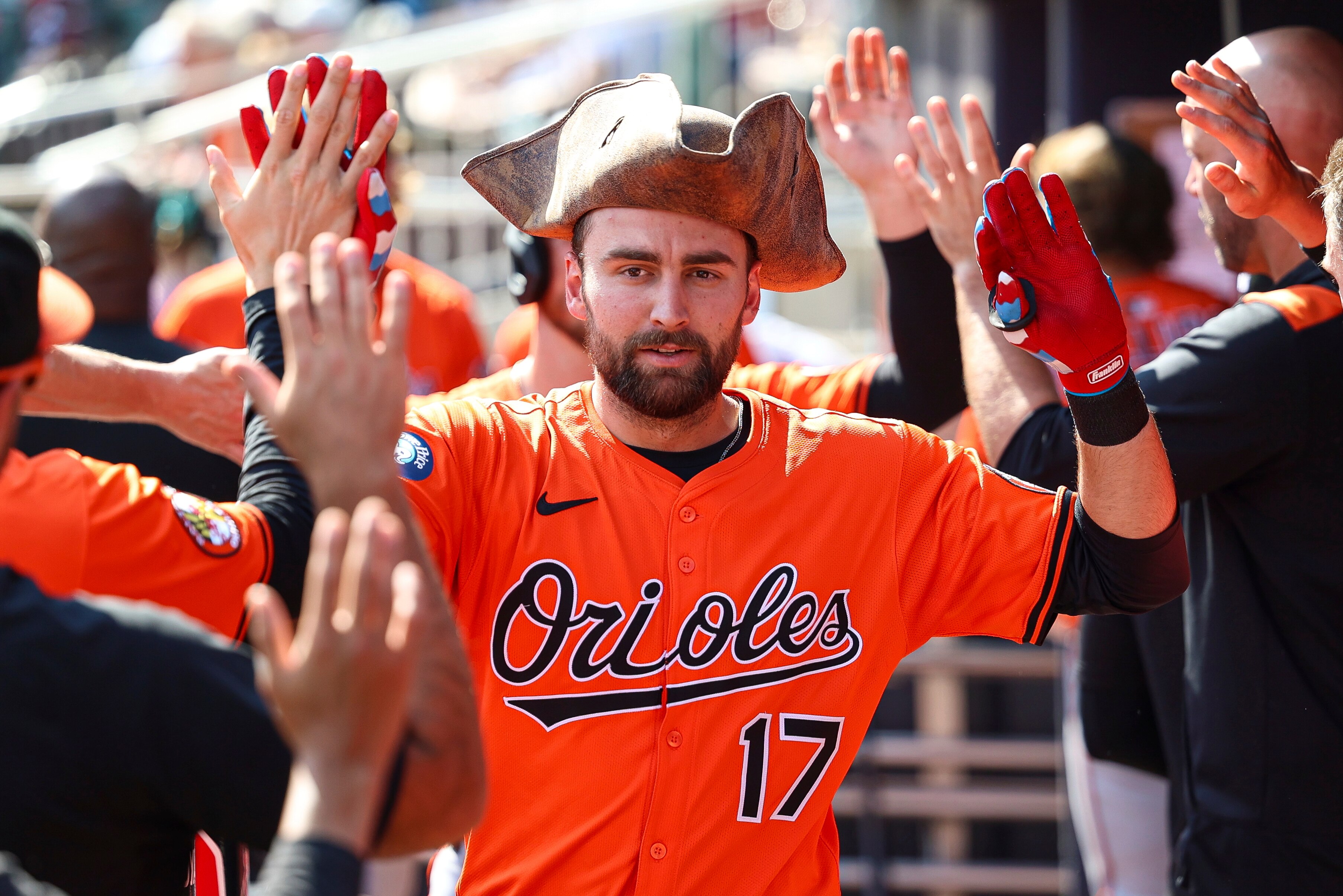 Orioles outfielder Colton Cowser high-fives teammates in the dugout after hitting one of the team’s three home runs Saturday in Atlanta.