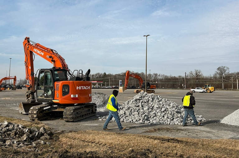 Bulldozers at Wilson Point Road and Eastern Boulevard are transforming open space into a warehouse, which local leader say violates the zoning.