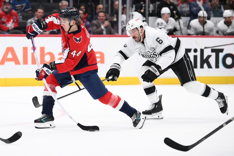 Washington Capitals defenseman Cole Hutson (44) shoots the puck against Los Angeles Kings defenseman Joel Edmundson (6) during the first period.