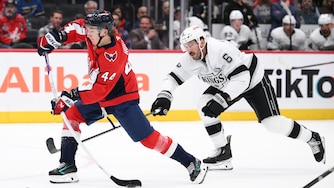 Washington Capitals defenseman Cole Hutson (44) shoots the puck against Los Angeles Kings defenseman Joel Edmundson (6) during the first period.