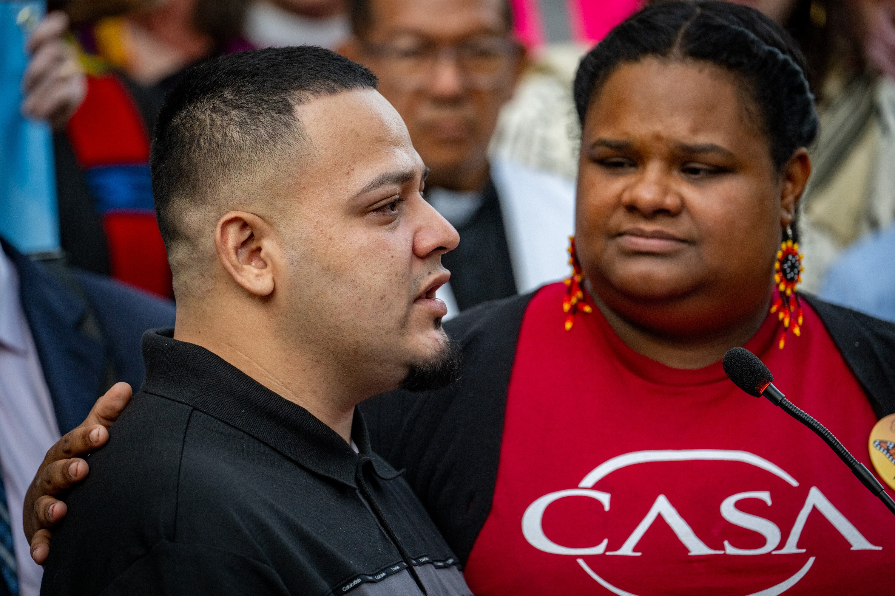 Kilmar Abrego Garcia is comforted by CASA member Lydia Walther-Rodriguez as he gets emotional while speaking to the crowd outside the George H. Fallon Federal Building in downtown Baltimore in August.