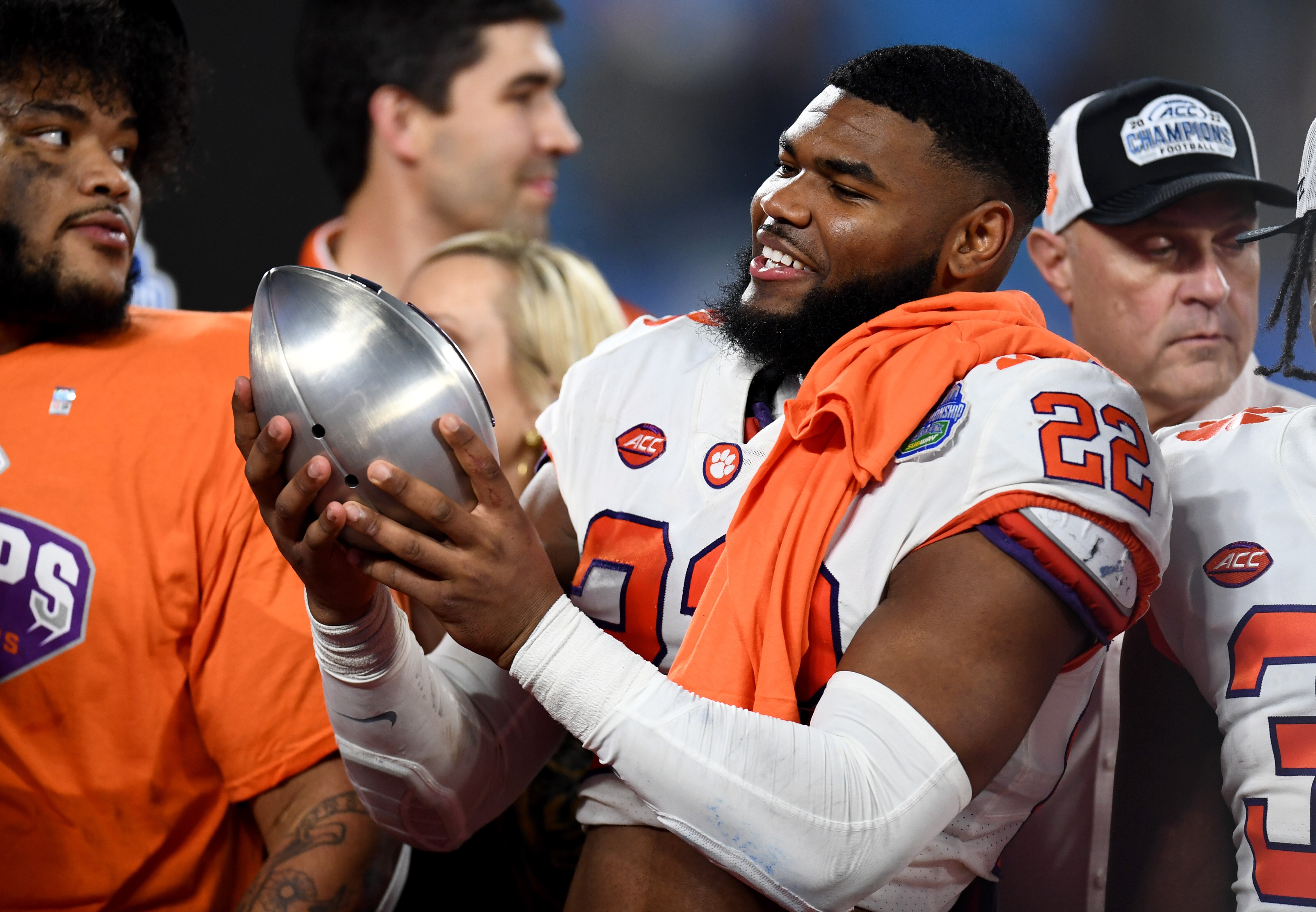Trenton Simpson #22 of the Clemson Tigers holds the trophy after defeating North Carolina Tar Heels in the ACC Championship game at Bank of America Stadium on December 03, 2022 in Charlotte, North Carolina.