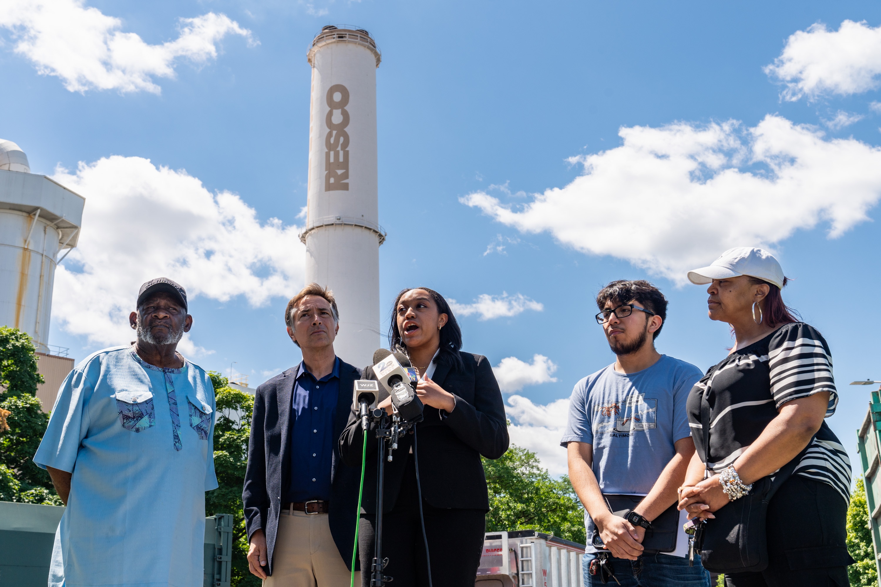 Attorney Taylor Lilley of the Chesapeake Bay Foundation, center, speaks during a press conference announcing a civil rights complaint filed to the EPA about the WIN Waste incinerator on May 29, 2024.