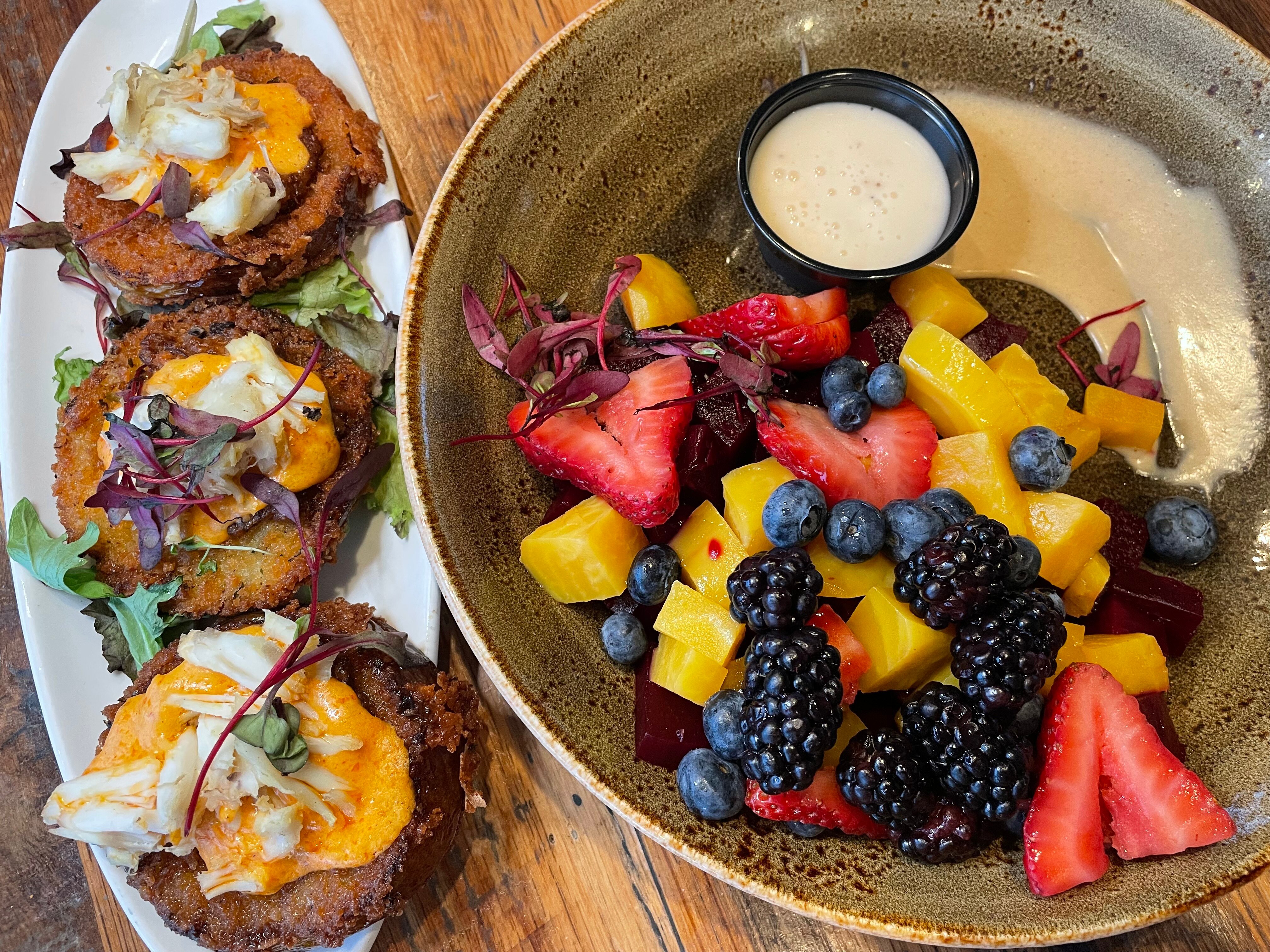 Fried green tomatoes and a berry and beet salad are appetizers at Shark on the Harbor, a West Ocean City staple for inventive, locally sourced fare.