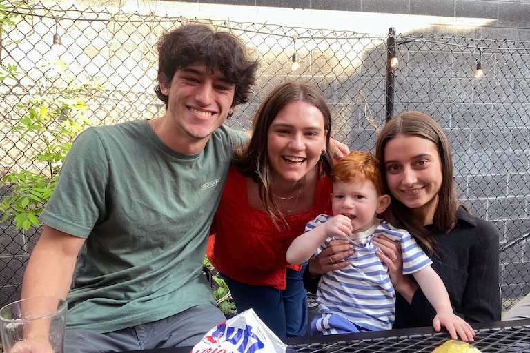 Susan Van Buren's grandchildren celebrate her life with crab chips at Mt Royal Tavern in April. From left, Nilo Mazzei, Isobel Triggs, grand-nephew Parker Hunley and Flavia Mazzei.
