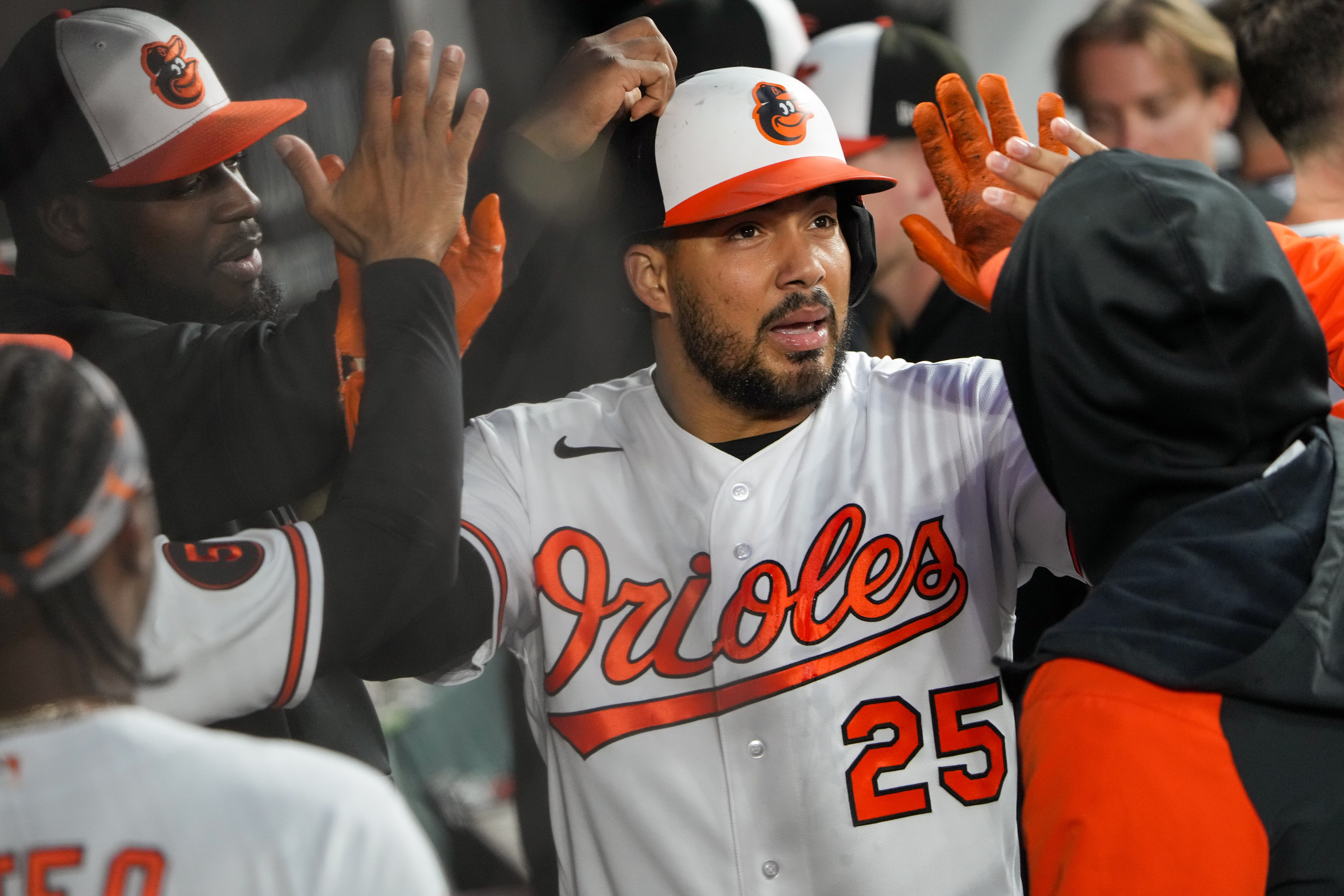 Orioles right fielder Anthony Santander accepts high-fives in the dugout after his home run gave the team the lead in the bottom of the first inning Thursday night.