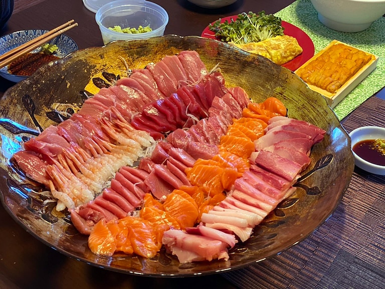 Payesone M. Hakamata and his wife, Shiho, co-own Bethesda's Zao Stamina Ramen. They favor a Japanese-influenced Thanksgiving and alternate between yakiniku, Japanese barbecue, and a sushi/sashimi platter. The spread seen here in 2022 with sashimi.