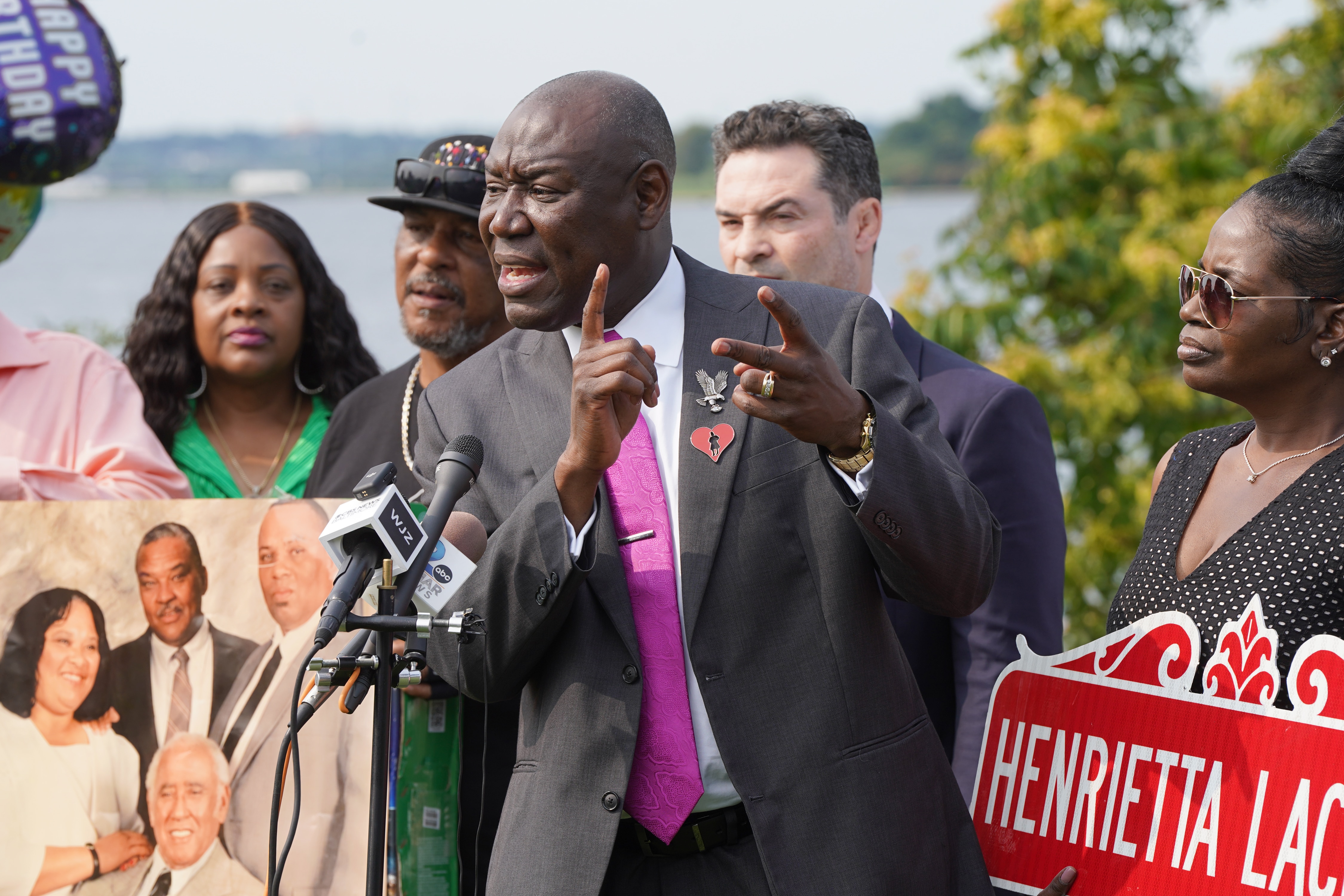 Henrietta Lacks’ living relatives reached a settlement with a biotechnology company they sued seeking compensation for its routine use of cells that were taken from her decades ago without her consent. Attorney Ben Crump, center, says there are others who’ve profited off her cells that the family may bring to court.