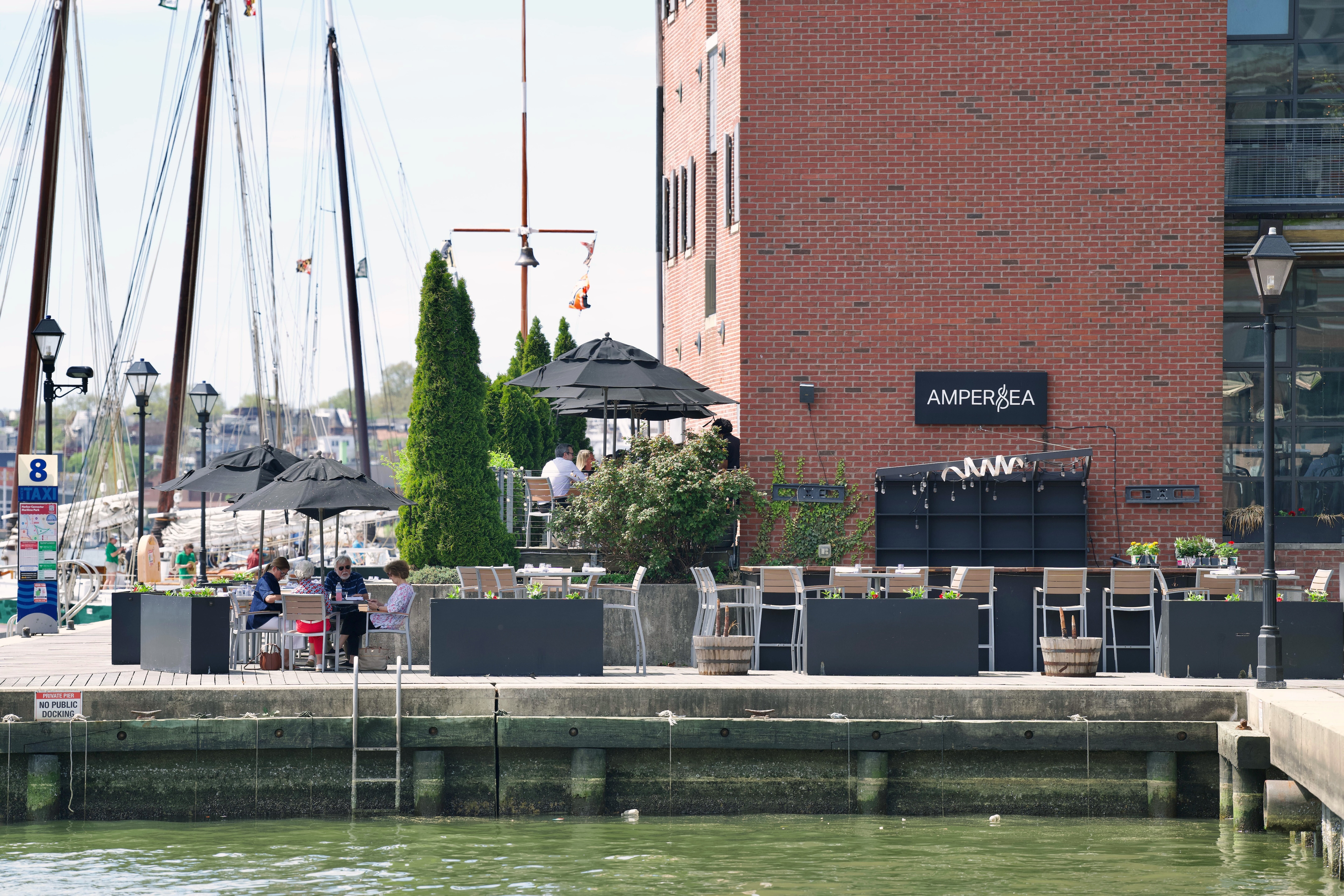 The patio seating at Ampersea, a restaurant located on the water at the intersection of Fells Point and Harbor East.