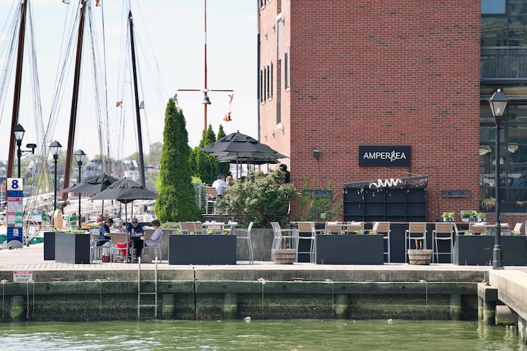 The patio seating at Ampersea, a restaurant located on the water at the intersection of Fells Point and Harbor East.