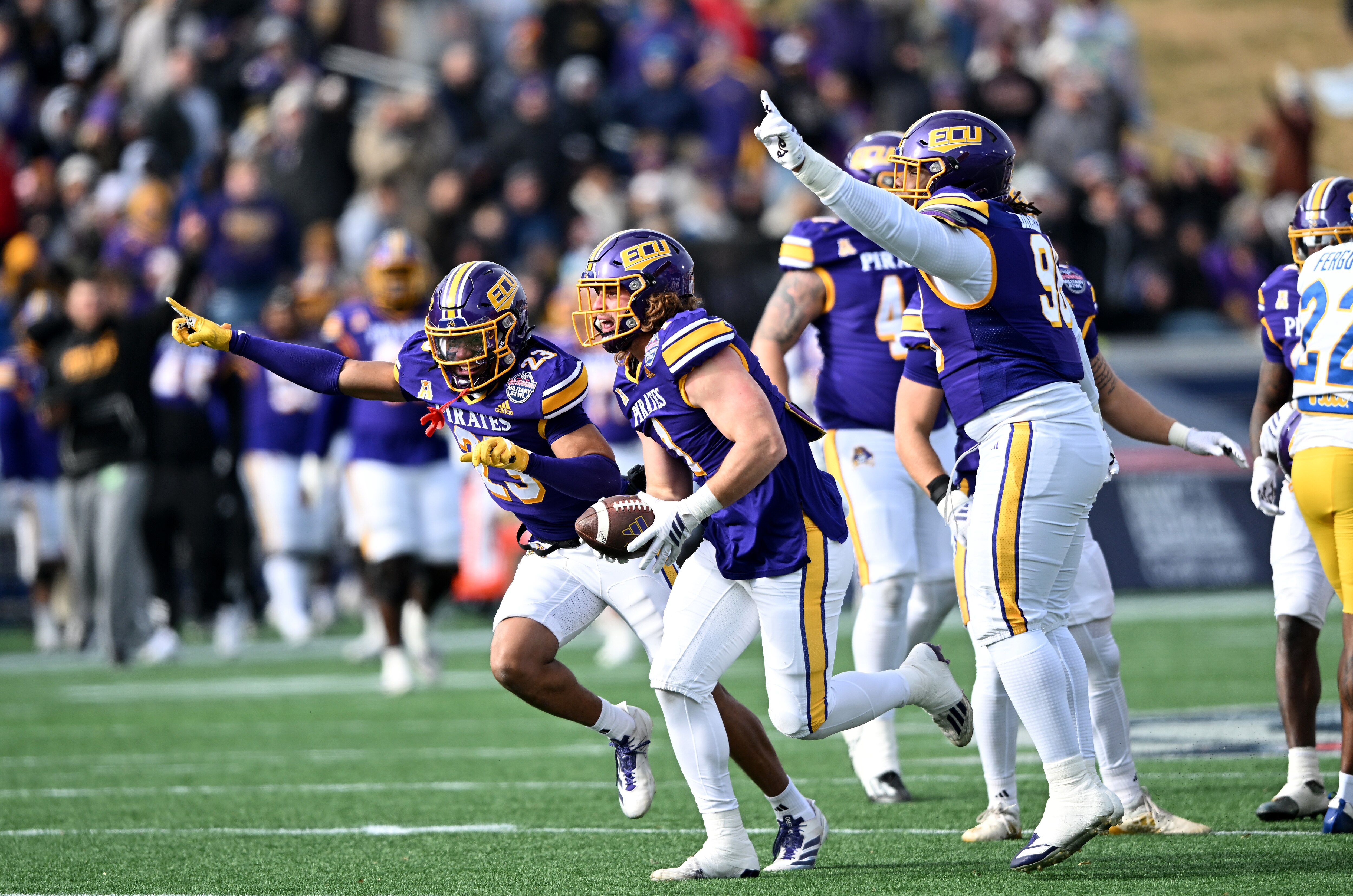Jackson Barker of East Carolina celebrates a fumble recovery during the second quarter of the Pirates’ 23-21 win over Pittsburgh in the Military Bowl on Saturday.