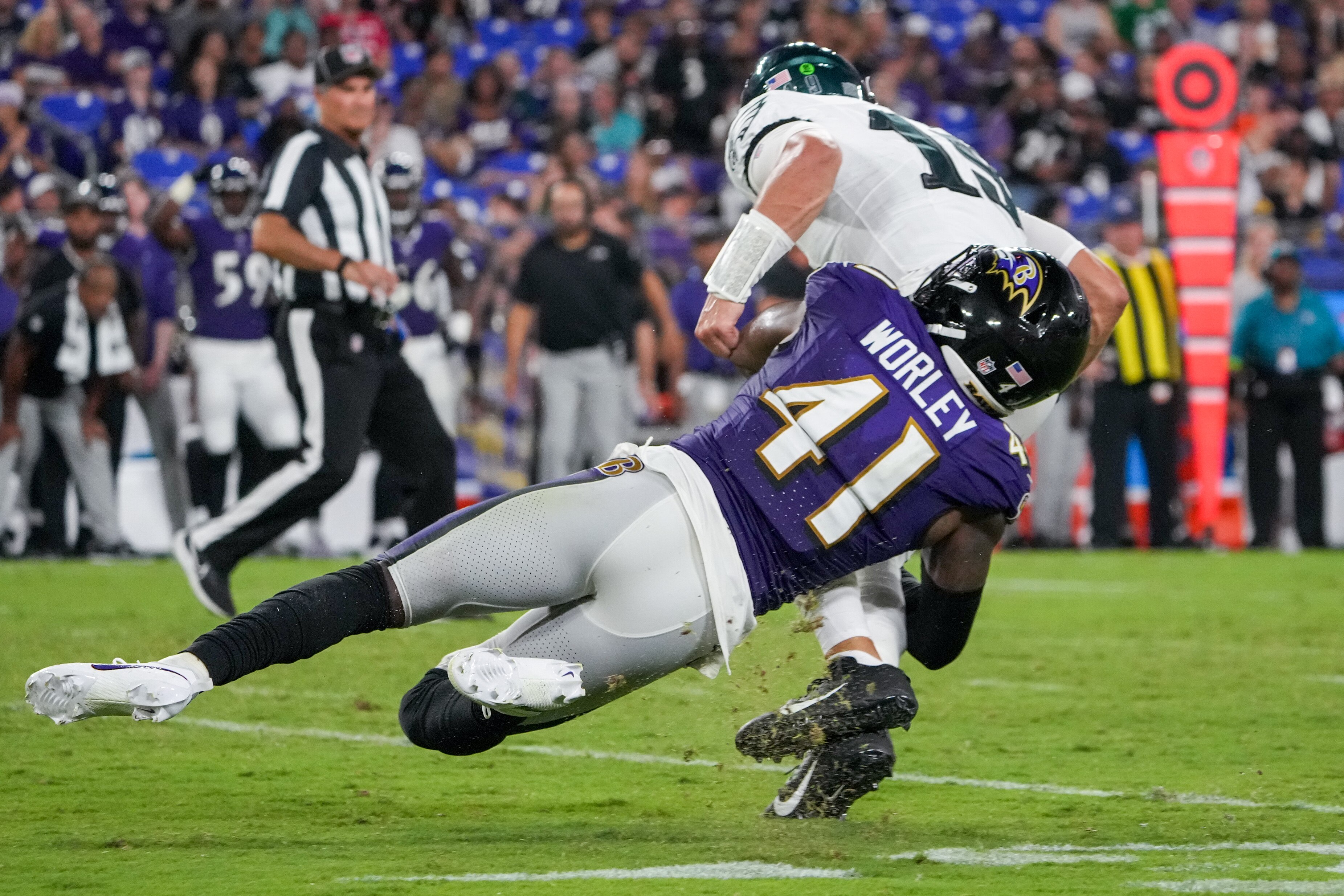 Ravens safety Daryl Worley sacks the Eagles' Ian Book during a preseason game.
