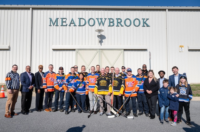 Howard County Executive Calvin Ball, joined by members of the Howard County Heat ice hockey team, announces funding for an ice rink at the Meadowbrook Athletic Complex in Ellicott City.