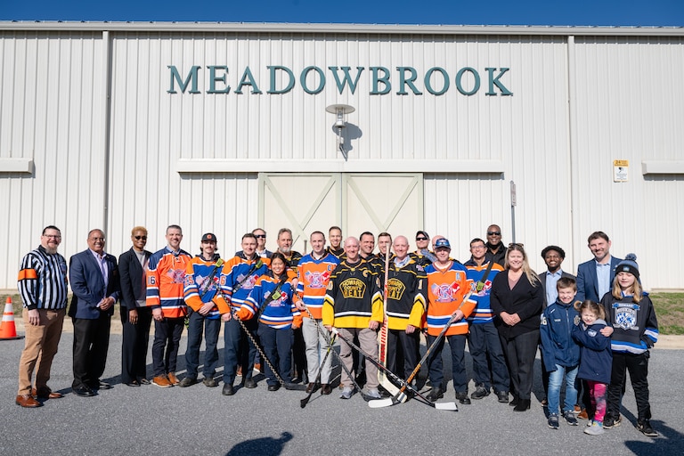 Howard County Executive Calvin Ball, joined by members of the Howard County Heat ice hockey team, announces funding for an ice rink at the Meadowbrook Athletic Complex in Ellicott City.