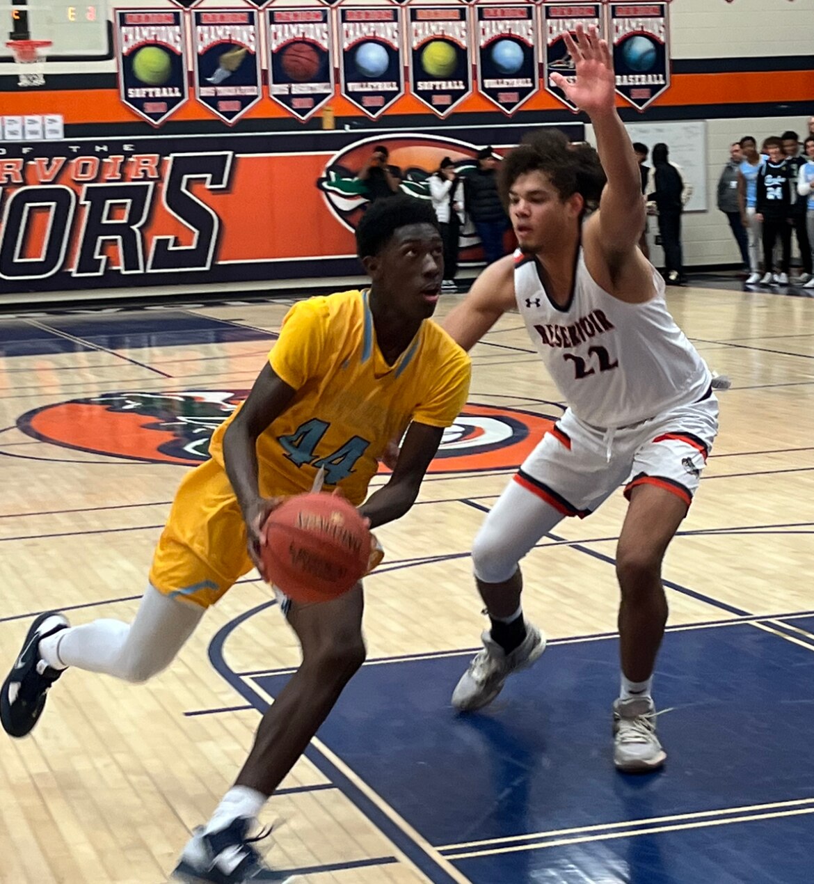 River Hill's Aiden Igwebe drives past Reservoir's Trace Johnson during Friday's Howard County boys basketball contest. The Hawks gained second possession of second place with a 57-54 victory over Gators.
