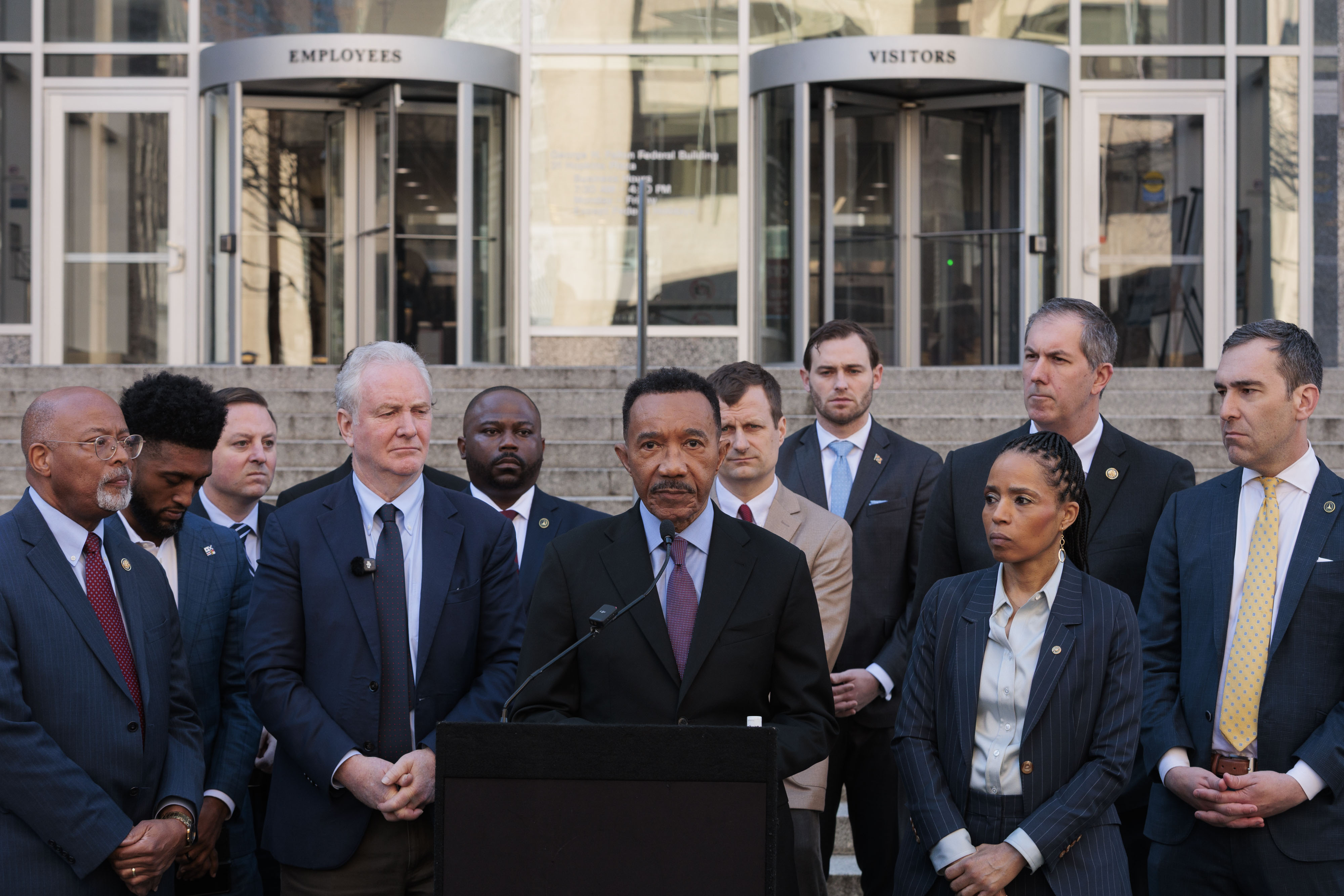 Rep. Kweisi Mfume, center, speaks at a press conference following an inspection of the Baltimore regional ICE field office on Monday. He was joined by Sens. Chris Van Hollen and Angela Alsobrooks, Reps. Glenn Ivey and Johnny Olszewski, and other local political leaders.