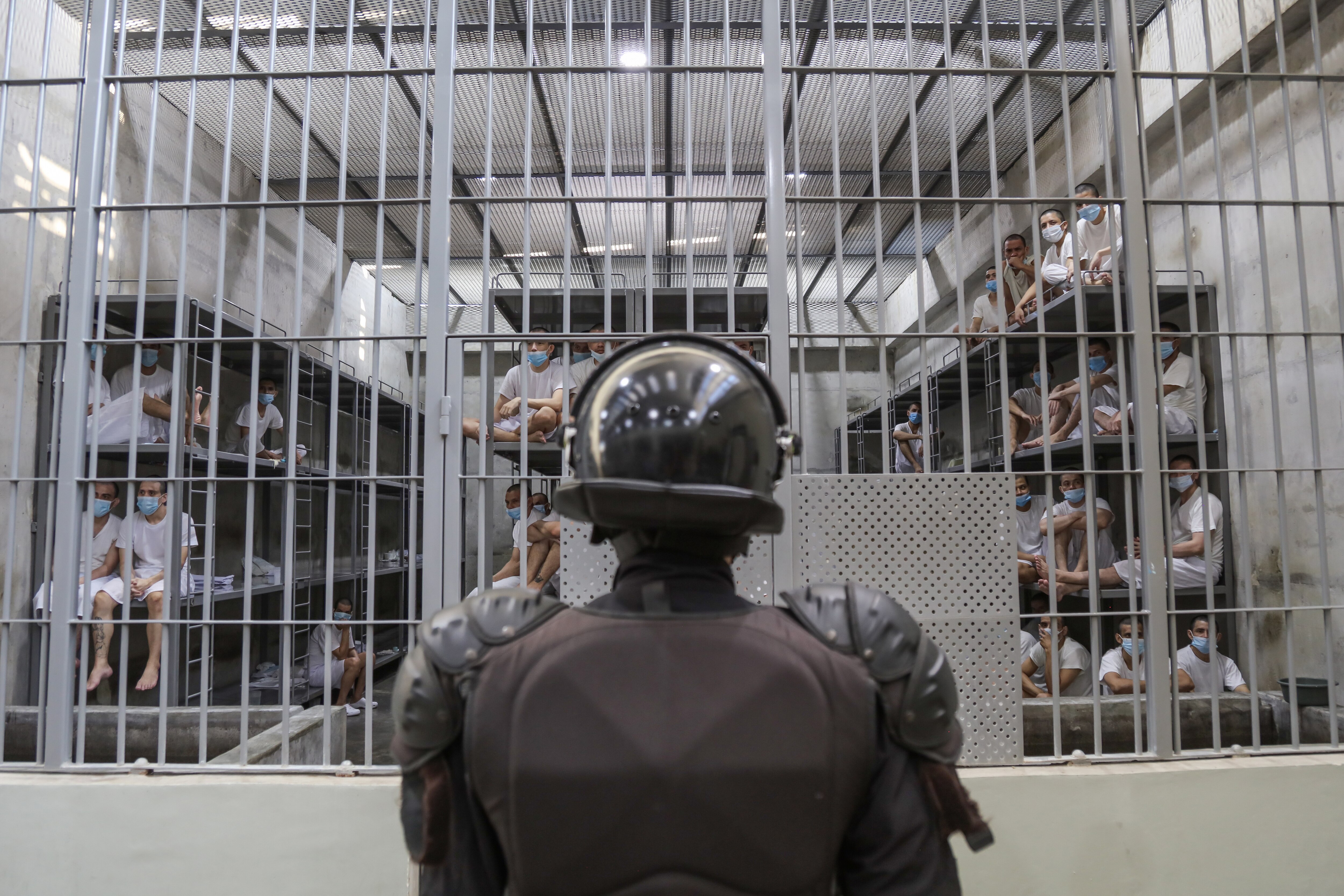 SAN VICENTE, EL SALVADOR - APRIL 4: A prison officer guards a cell at maximum security penitentiary CECOT (Center for the Compulsory Housing of Terrorism) on April 4, 2025 in Tecoluca, San Vicente, El Salvador. Amid internal legal dispute, Trump's administration continues with its controversial and fast-paced deportation policy to El Salvador, as part of a partnership with President Bukele. The US Government acknowledged mistakenly deporting a Maryland resident from El Salvador with protected status and is arguing against returning him to the US.
