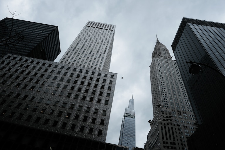 Skyscrapers loom over downtown Manhattan on March 31, 2022 in New York City. New York City Mayor Eric Adams has said that remote work is hurting the city’s economy which depends on workers patronizing restaurants and other businesses. According to New York State Department of Labor, New York City’s seasonally adjusted unemployment rate stood at 7% in February — down by 5.5% from February 2021 but still higher than February of 2020. Despite the numbers, there is a significant increase in foot traffic in Manhattan with many area restaurants and bars starting to have long wait times at peak hours.
