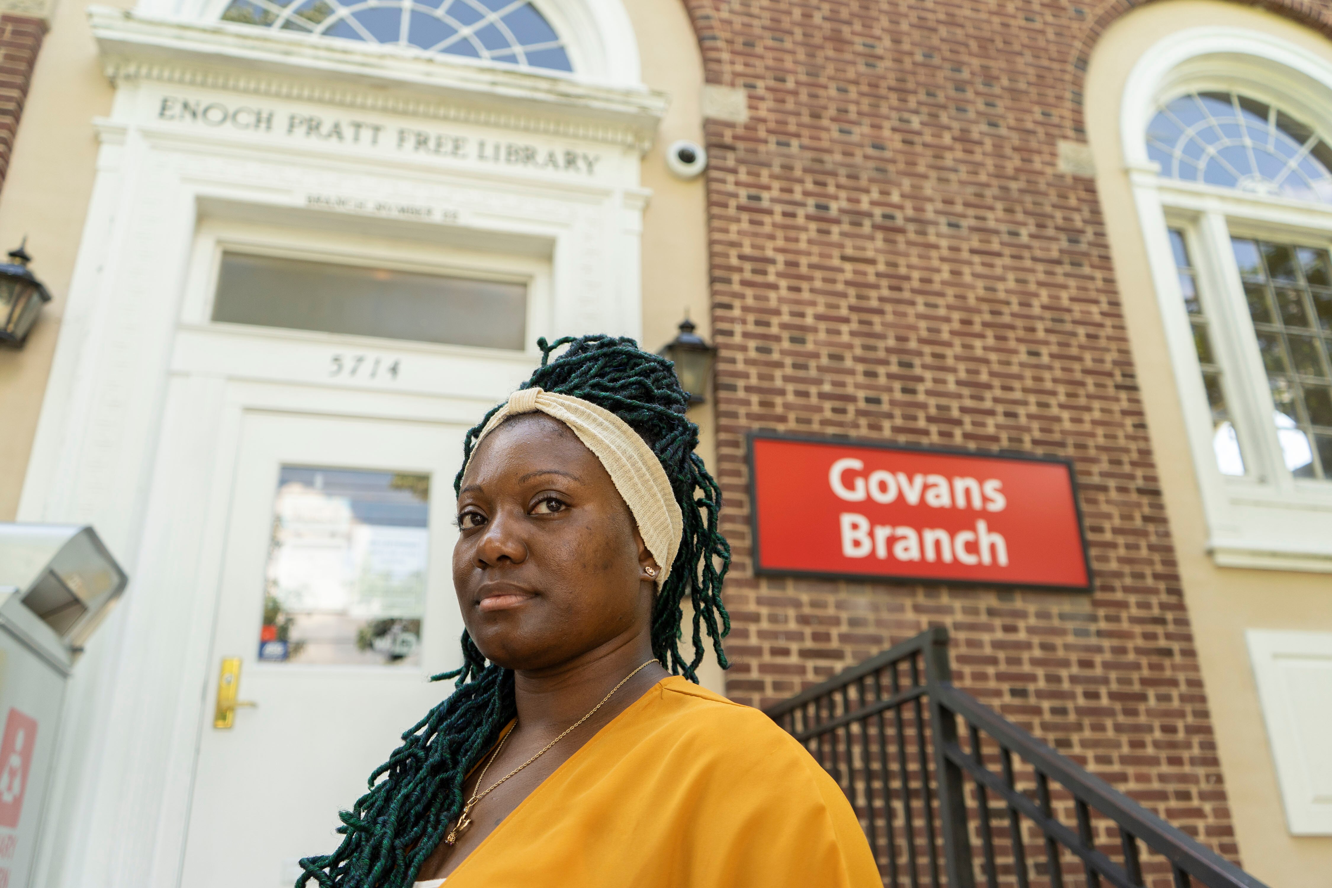 Chante Richardson outside of Enoch Pratt Free Library-Govans Branch on Bellona Avenue August 9, 2022. Richardson was attempting to return books in the library return box, but the box was full to the top.