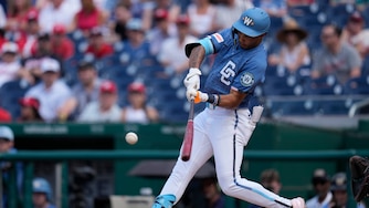 Daylen Lile #4 of the Washington Nationals hits an RBI triple against the Seattle Mariners during the first inning at Nationals Park on June 13, 2026 in Washington, D.C.