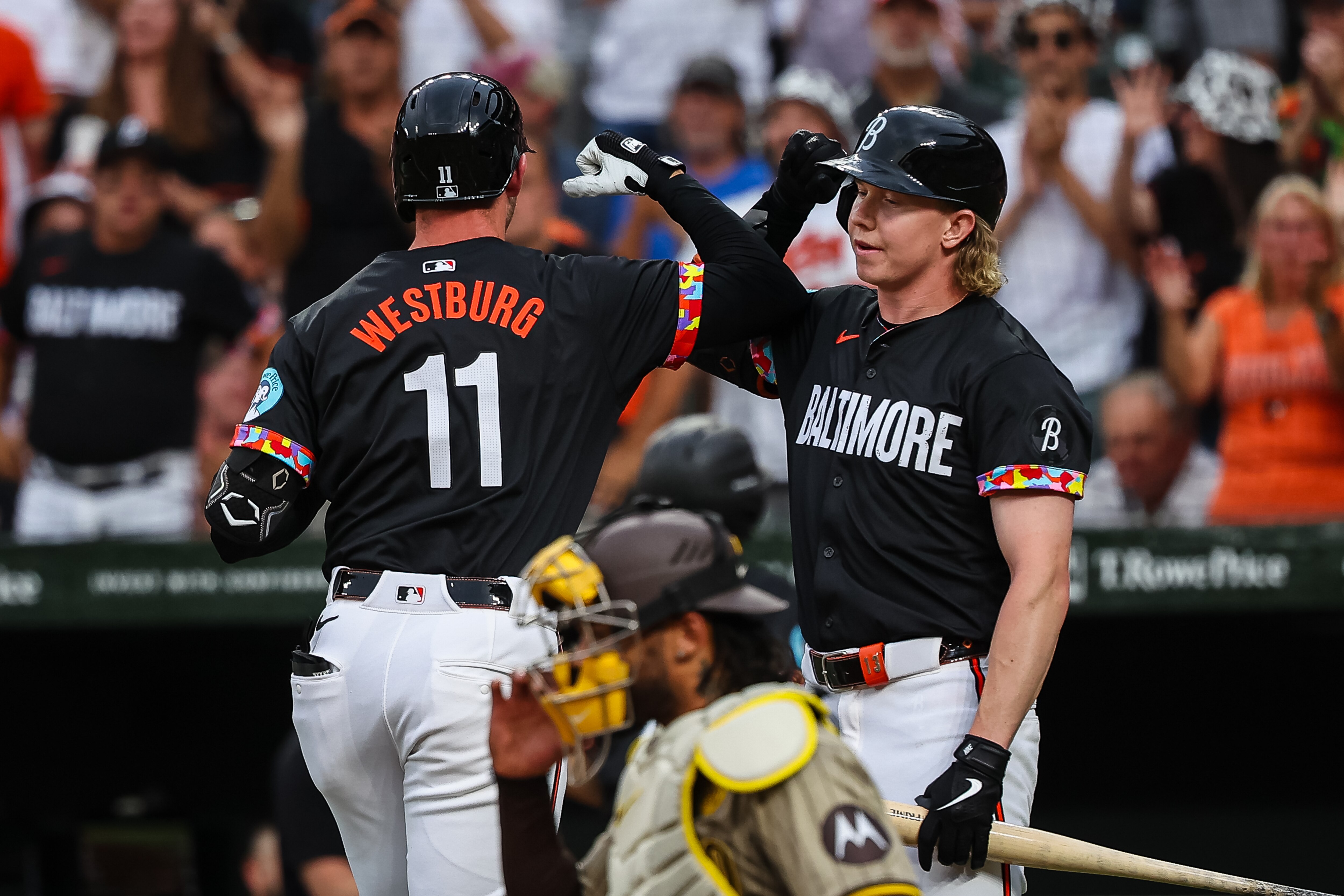Heston Kjerstad greets Jordan Westburg after Westburg’s solo home run in the second inning Friday night at Camden Yards.
