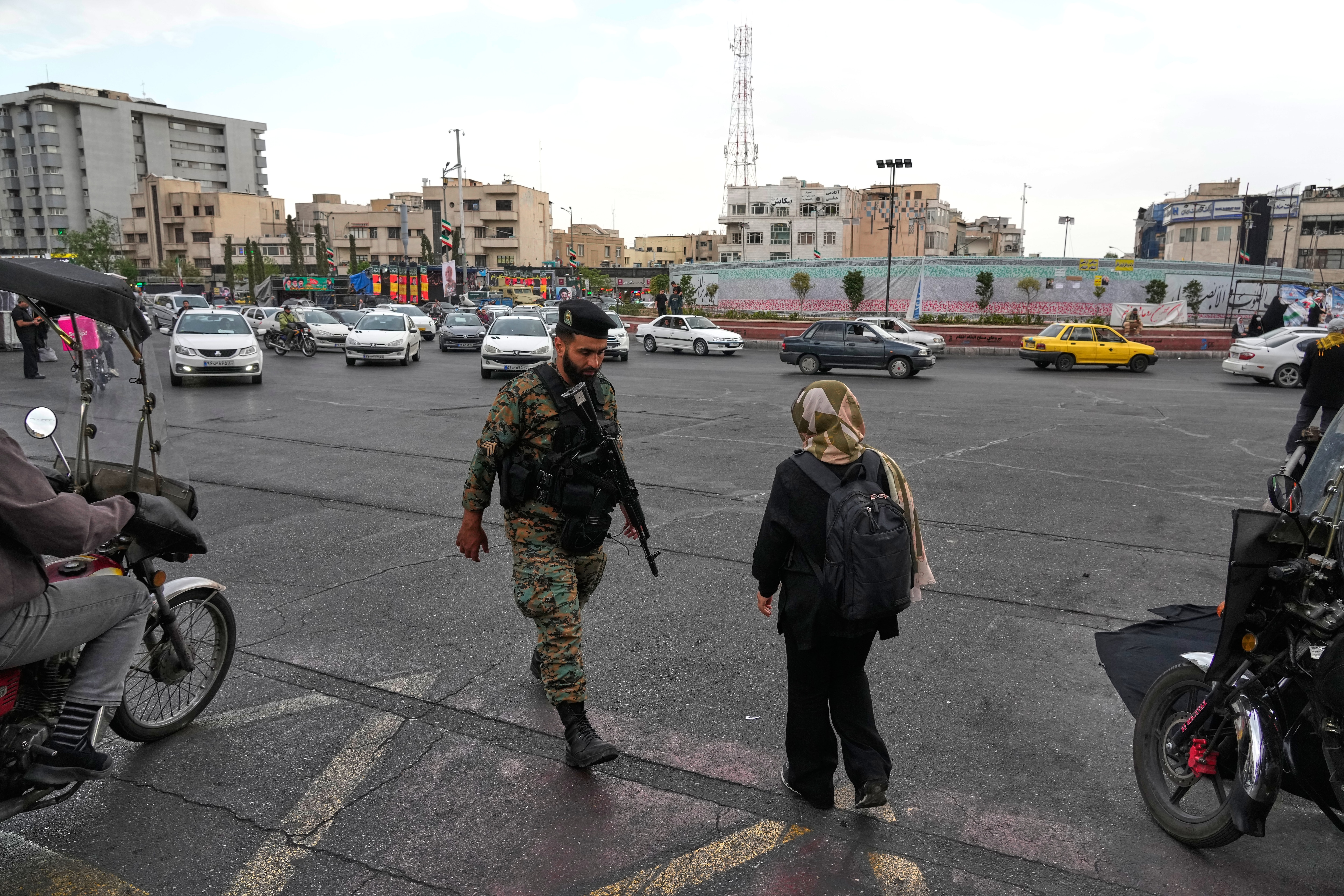 A policeman walks at the Enqelab-e-Eslami, or Islamic Revolution, Square in downtown Tehran, Iran, Monday, April 13, 2026.