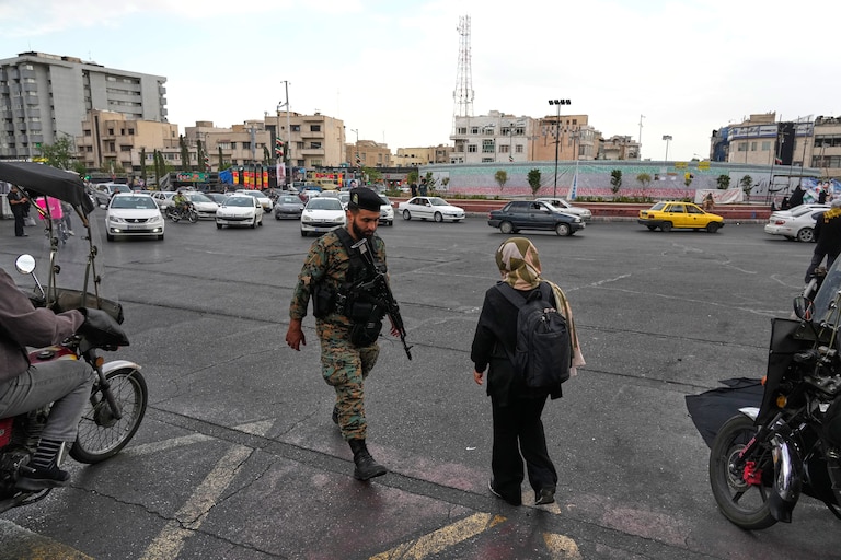 A policeman walks at the Enqelab-e-Eslami, or Islamic Revolution, Square in downtown Tehran, Iran, Monday, April 13, 2026.