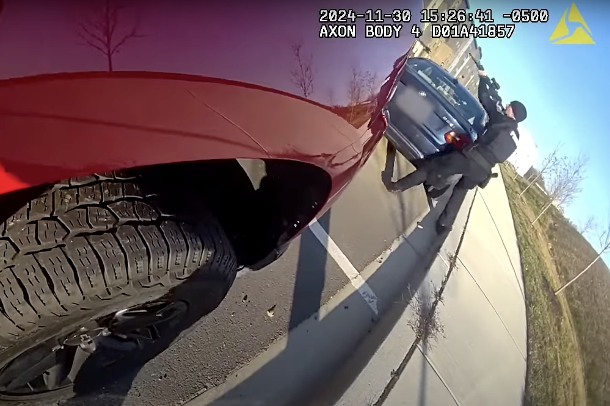A still from footage off a body camera worn by Howard County police officer Christopher Weir shows officer Joseph Debronzo taking aim with his weapon at a residence on the 10000 block of American Pharoah Lane after both responded to a reported domestic incident. Blurring seen in the image was done prior to release by the Maryland Office of the Attorney General.