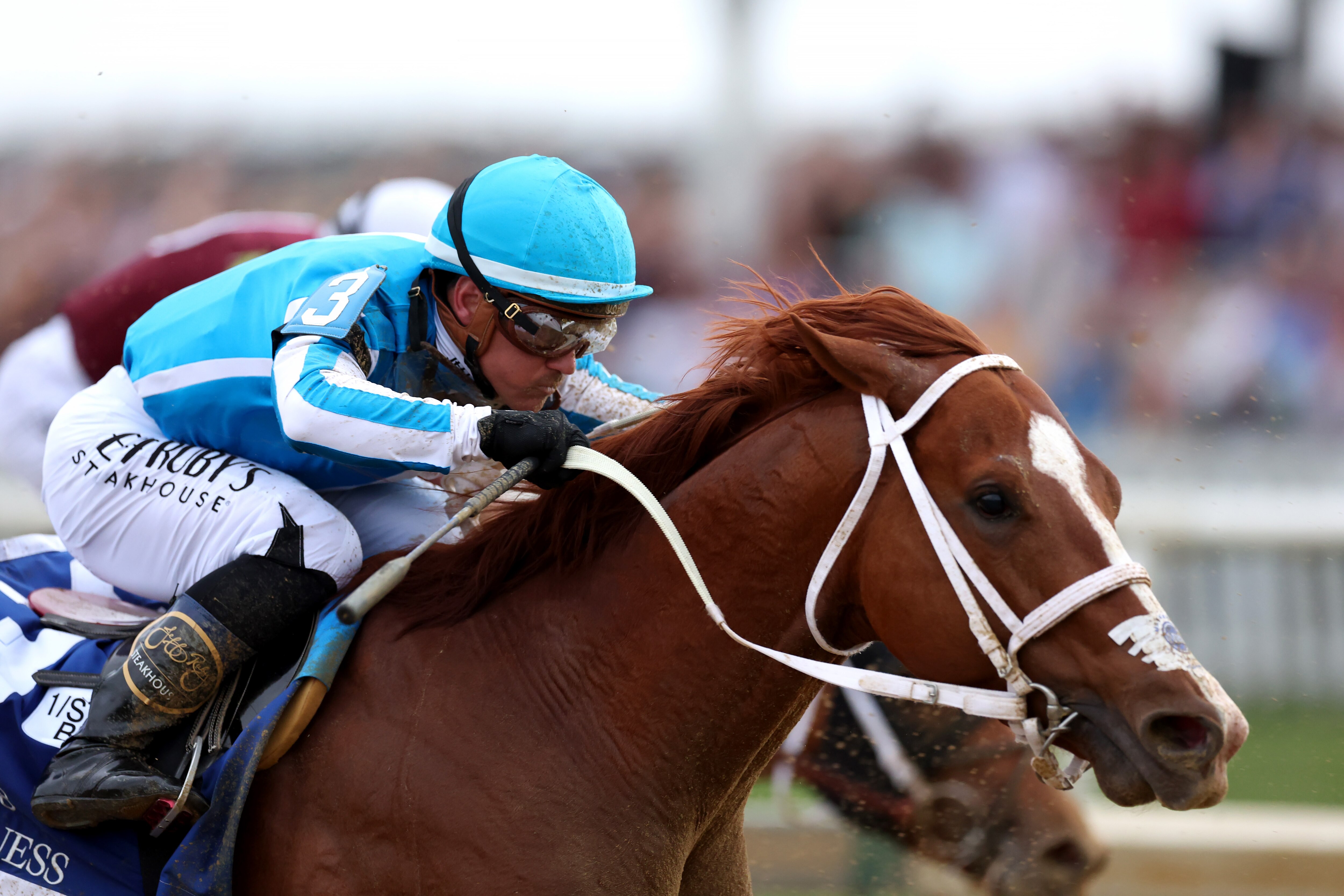 Jockey Javier Castelliano rides Mage #3 out of the fourth turn during the 148th Running of the Preakness Stakes at Pimlico Race Course on May 20, 2023 in Baltimore, Maryland.