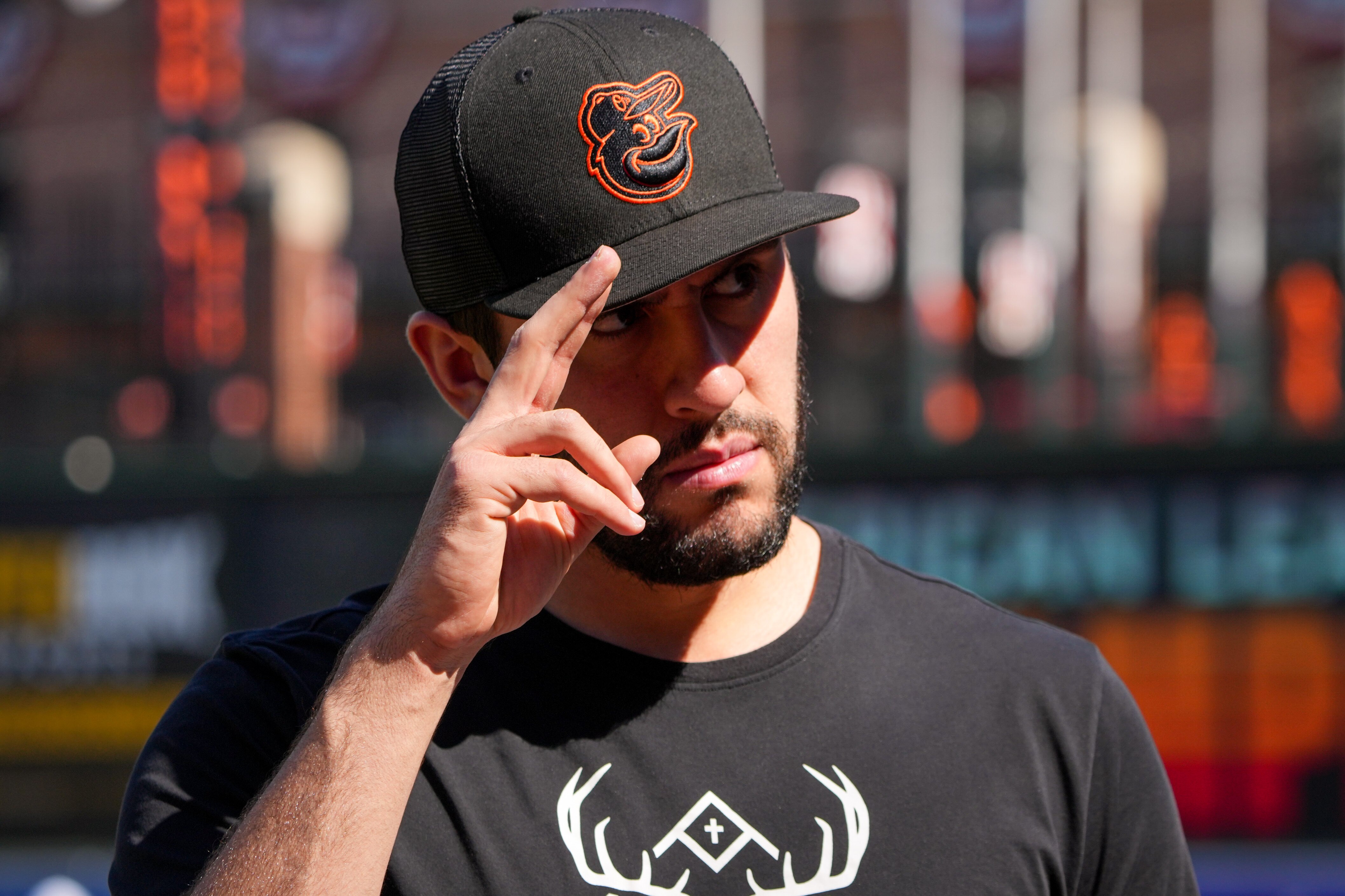 Orioles pitcher Grayson Rodriguez salutes the fans during an open practice at Camden Yards on Wednesday. He will start Game 2 Sunday.