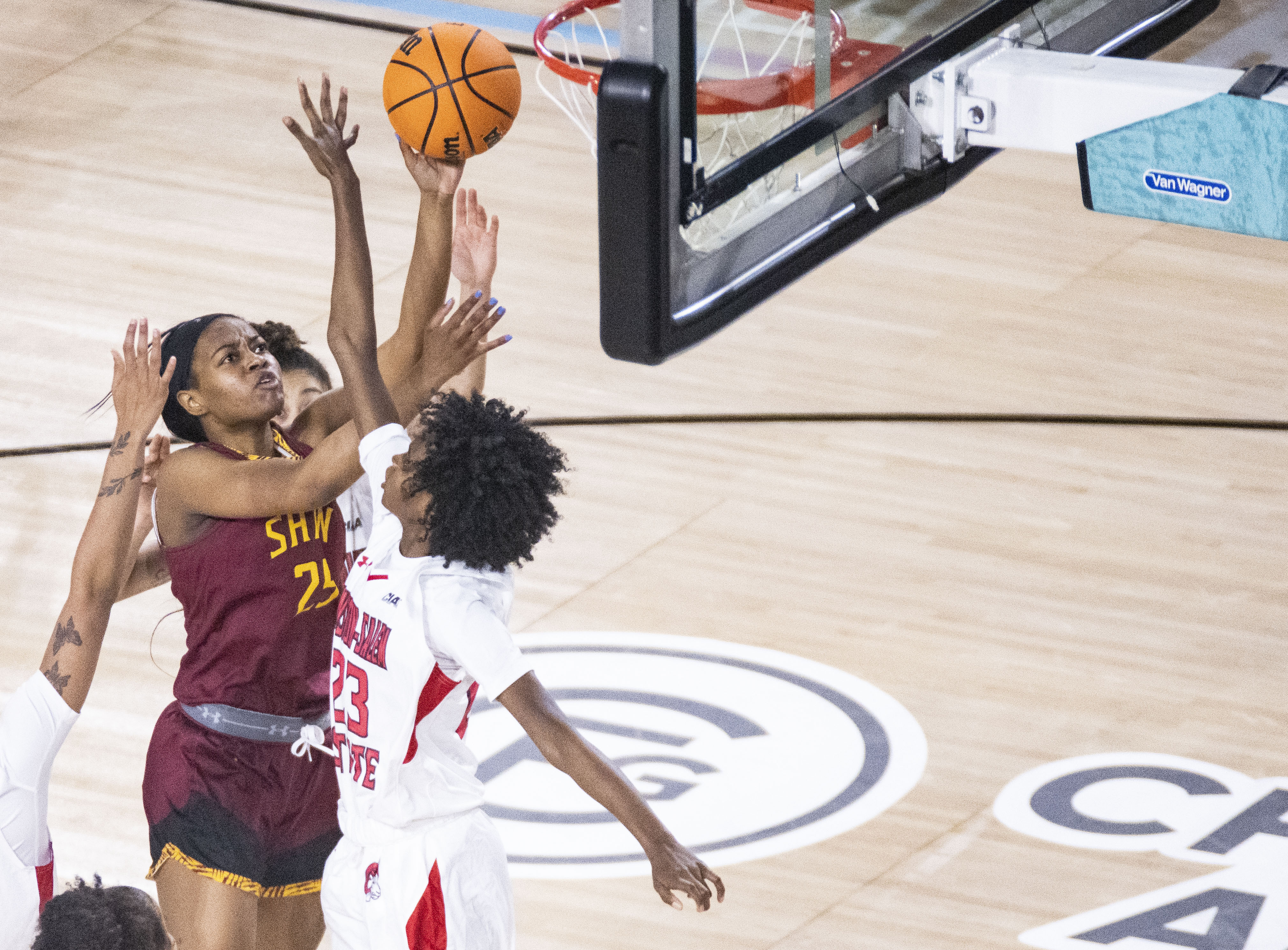 Shaw’s Makenzie Pollard (25) goes up for a shot against Winston-Salem State Valencia Carroll (23) during the quarterfinals at the CIAA tournament at CFG Bank Arena, Thursday, February 23, 2023.