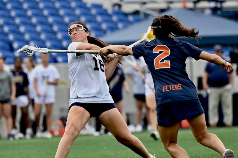 Sophomore attack Alyssa Chung takes a shot during Navy lacrosse's second-round NCAA tournament game against Syracuse at Navy Marine Corps Memorial Stadium on Sunday, May 10, 2026. Chung scored a team-best 4 goals including the game-winner in overtime as the Midshipmen prevailed in a comeback 11-10 victory.