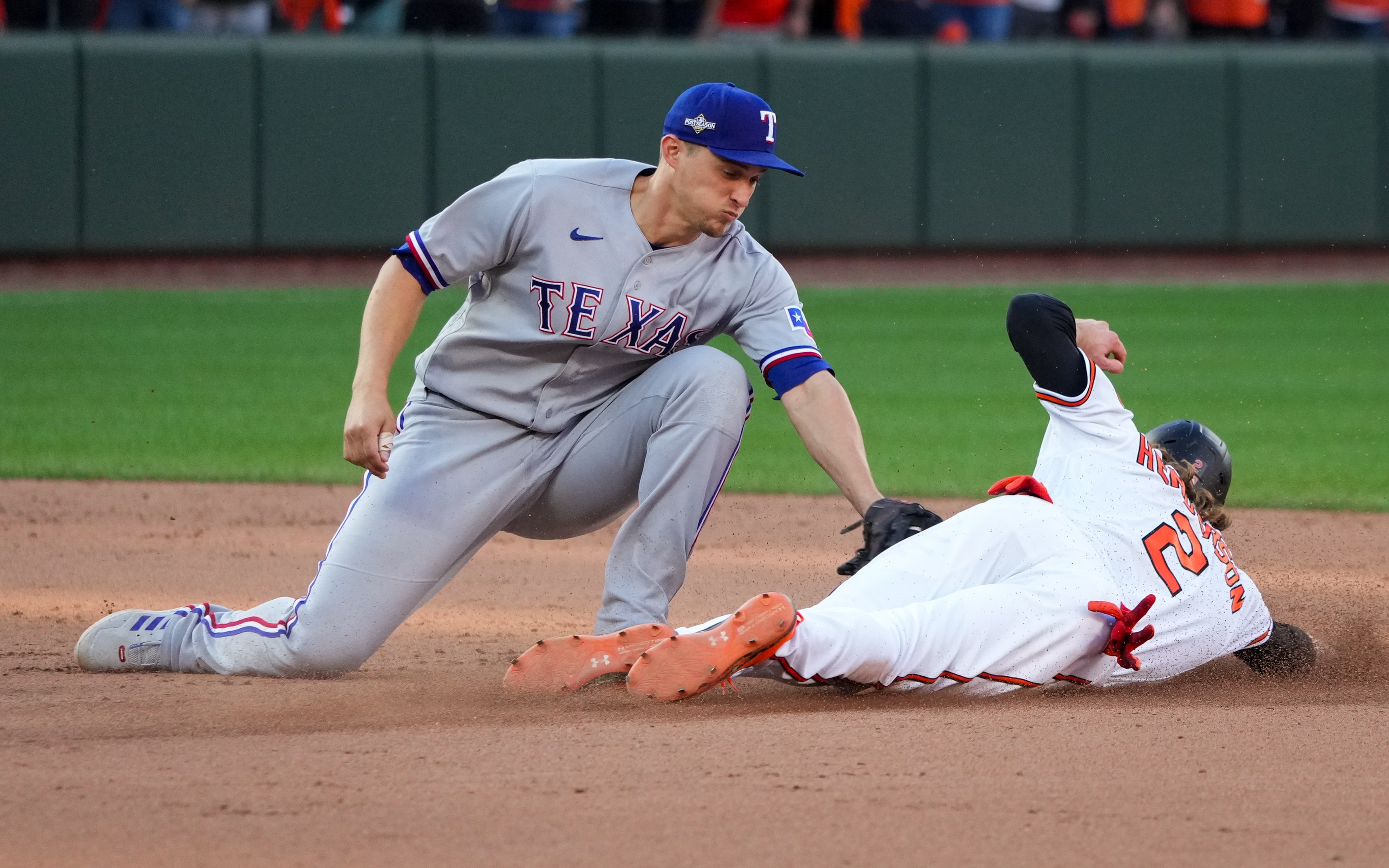 Baltimore Orioles shortstop Gunnar Henderson (2) tries to steal second base but is tagged out by Texas Rangers shortstop Corey Seager (5) during game one of the American League Divisional Series at Camden Yards on Saturday, October 7, 2023.