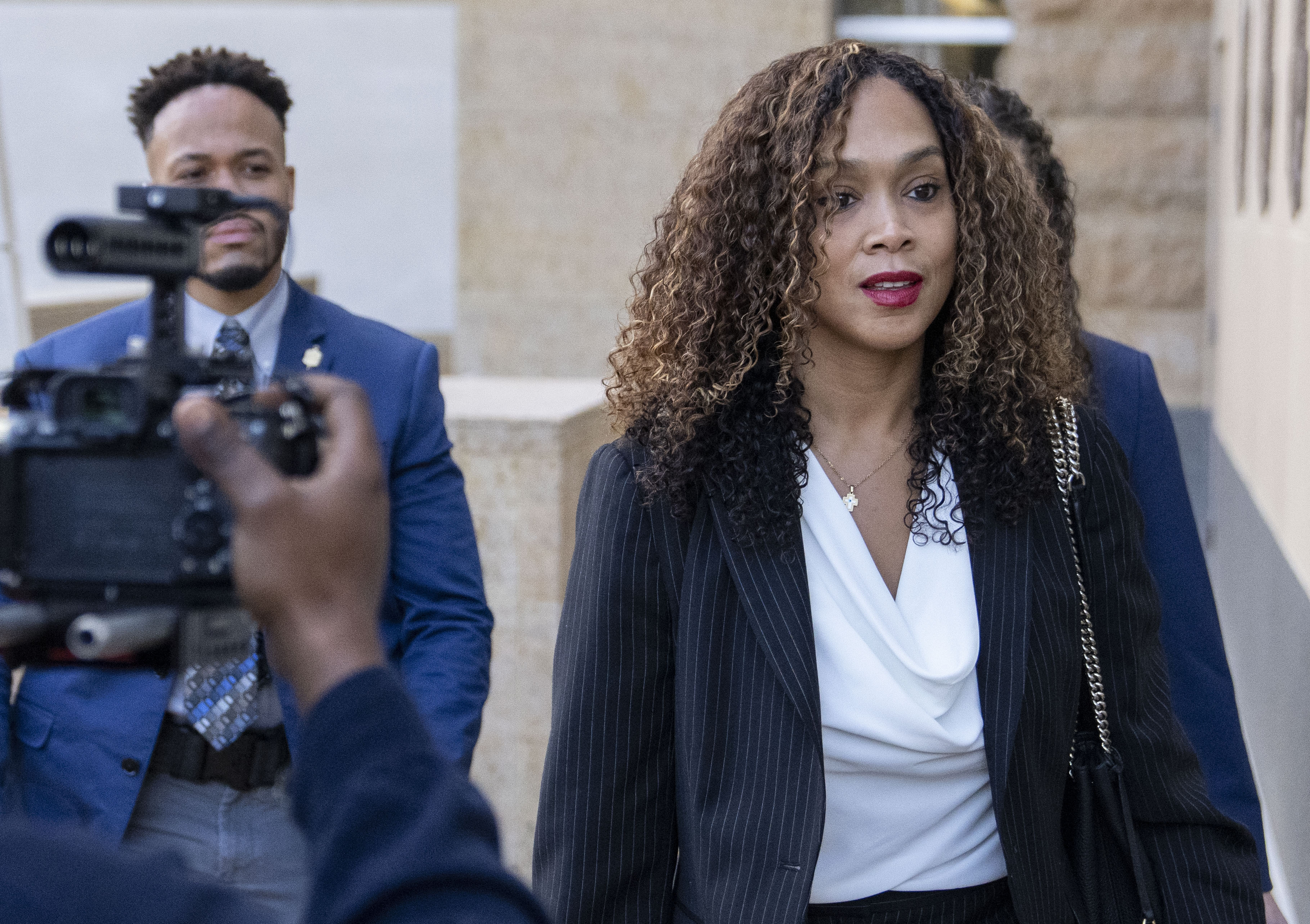 Former Baltimore State’s Attorney Marilyn Mosby enters U.S. District Court in Greenbelt on Tuesday for jury selection in her perjury trial. She’s accused of falsely claiming under oath that she experienced an adverse financial consequence from the COVID-19 pandemic to withdraw money early from a retirement account under the Coronavirus Aid, Relief, and Economic Security Act, or CARES Act.