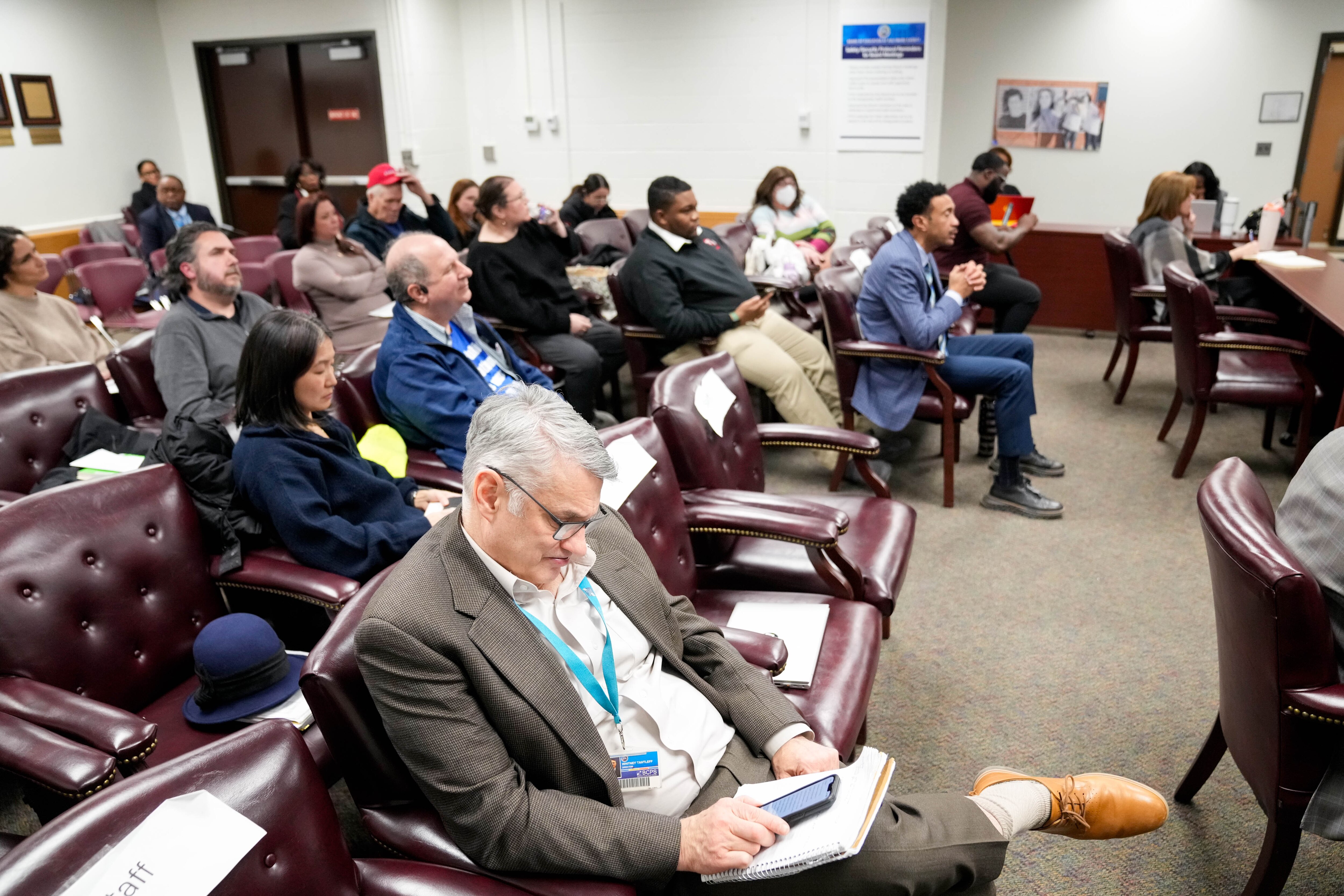 Attendees listen to public comments during the Board of Education of Baltimore County’s meeting at its Greenwood Campus in Towson in January.