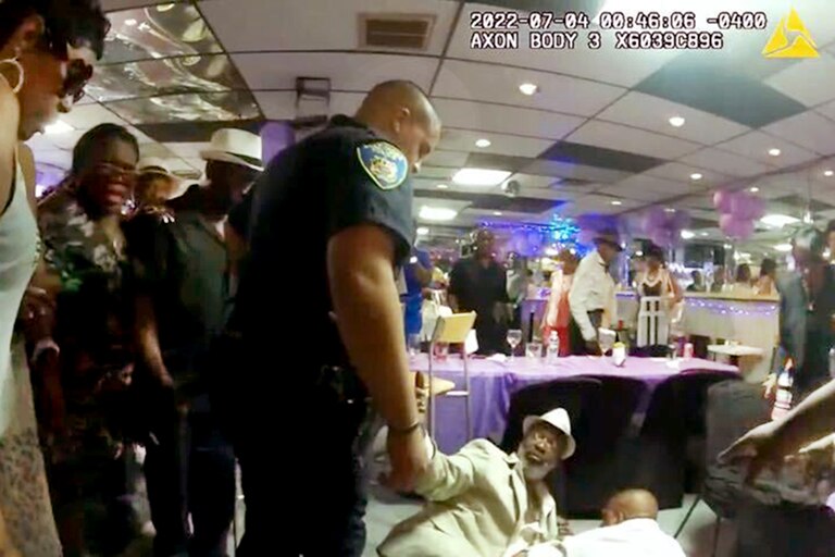 Police body cam photo of Lloyd Muldrow, center on the floor, defended a friend without pulling his handgun. Now he’s on probation in Baltimore.