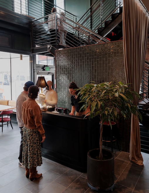 Guests arrive for the soft opening of Seppia, a new restaurant in Hampden by the owners of La Cuchara.