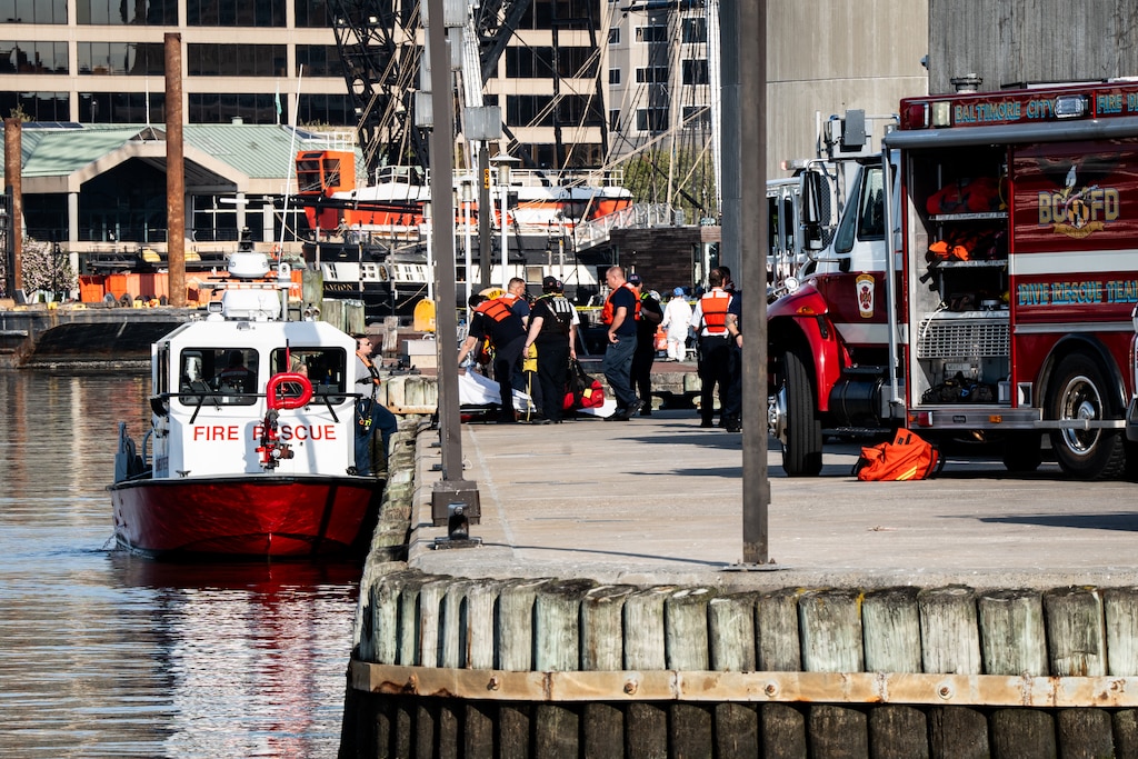 Baltimore City Fire and Police respond to the area around Pier 5 at the Inner Harbor Tuesday morning for a water rescue operation.