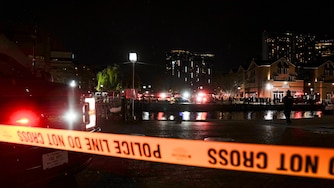 More than a dozen Baltimore fire trucks and police cars lined the area near the Pier 5 Pavilion on Tuesday, Nov. 18, 2025, as divers entered the water and rescue boats searched for the water.