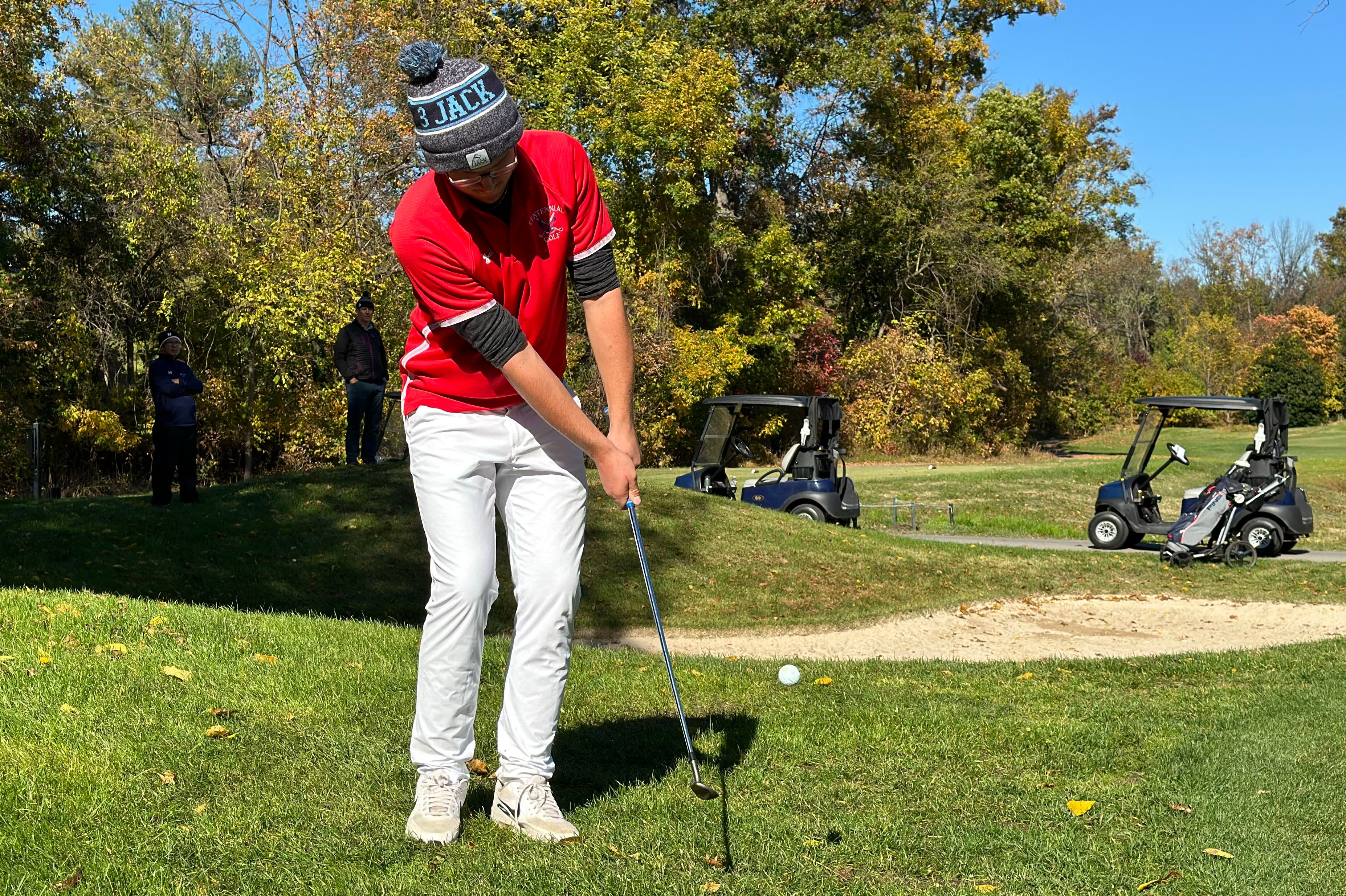Centennial's Dustin Stocksdale chips onto the green on the par 5 fifth hole at Fairway Hills Thursday. He made clutch shots all day to win the Howard County boys high school championship. It was his first high school tournament victory ever.
