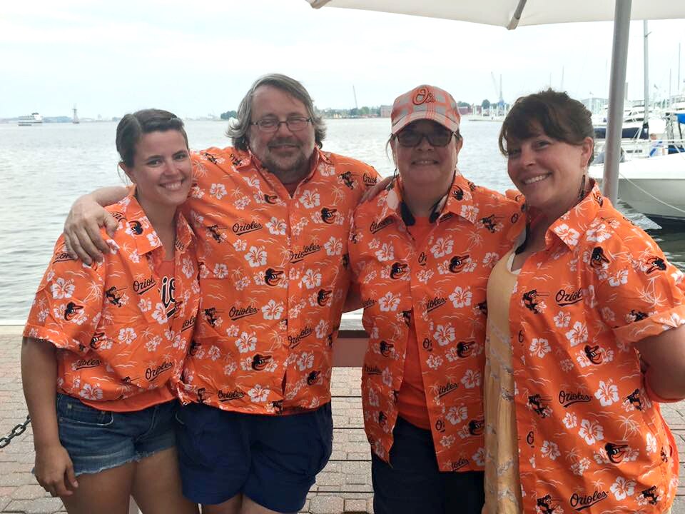 Amy, Skip, Debby and Sarah Nees wearing their Hawaiian shirt giveaways from the July 12, 2015 game.
