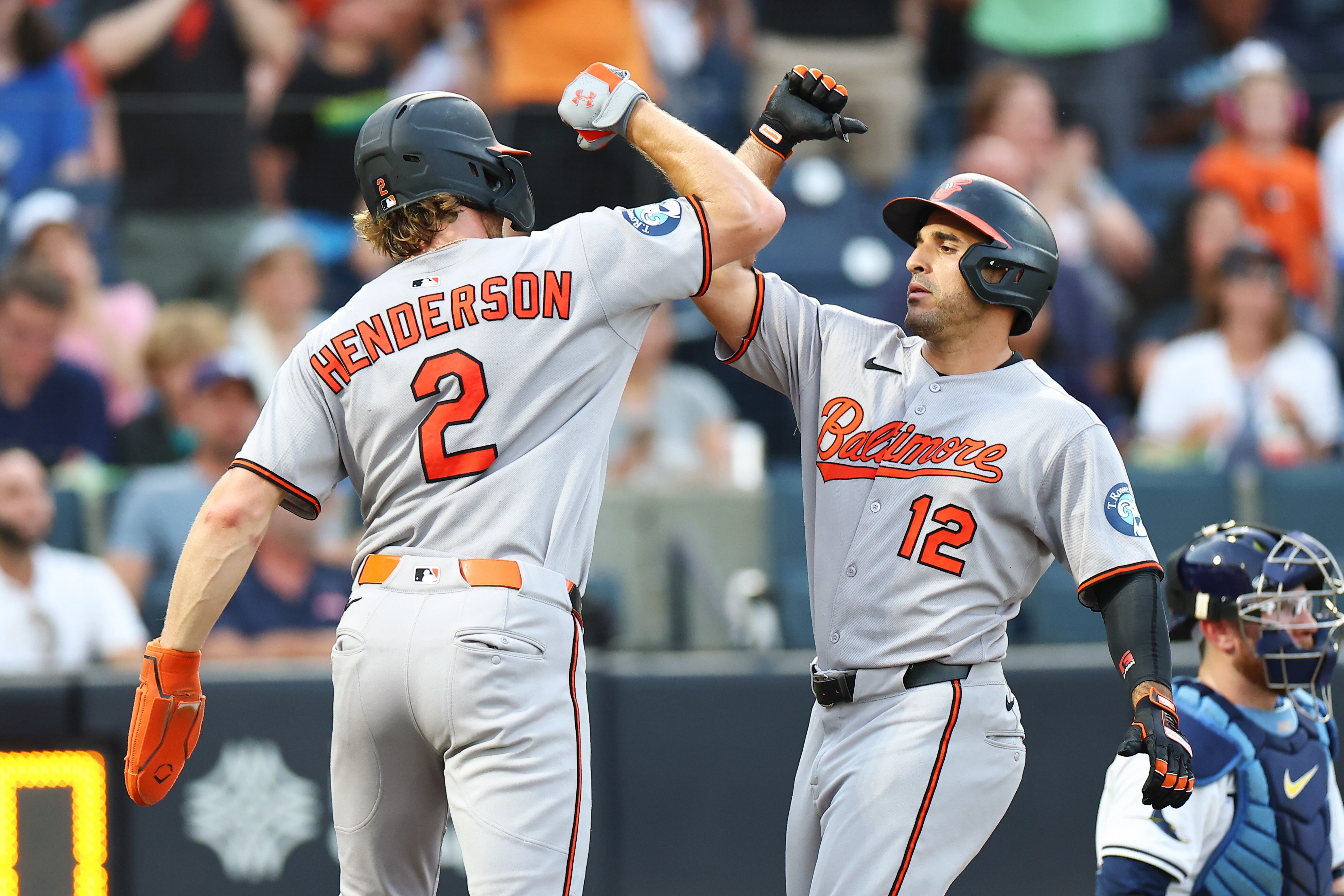 Ramón Laureano celebrates with Gunnar Henderson after hitting a three-run home run against the Tampa Bay Rays.
