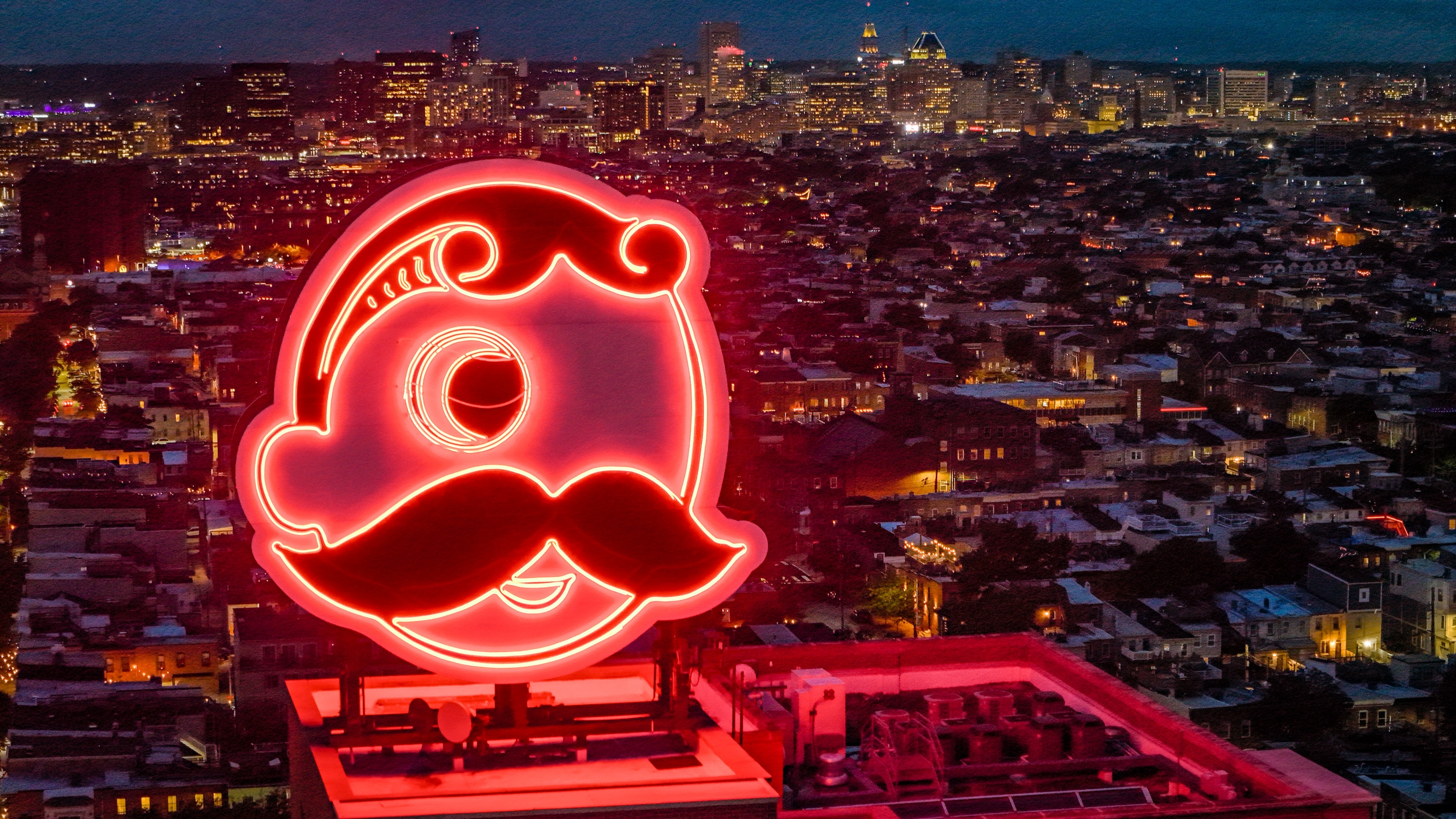 The Natty Boh man was recently relit, but he still has dark secrets.
