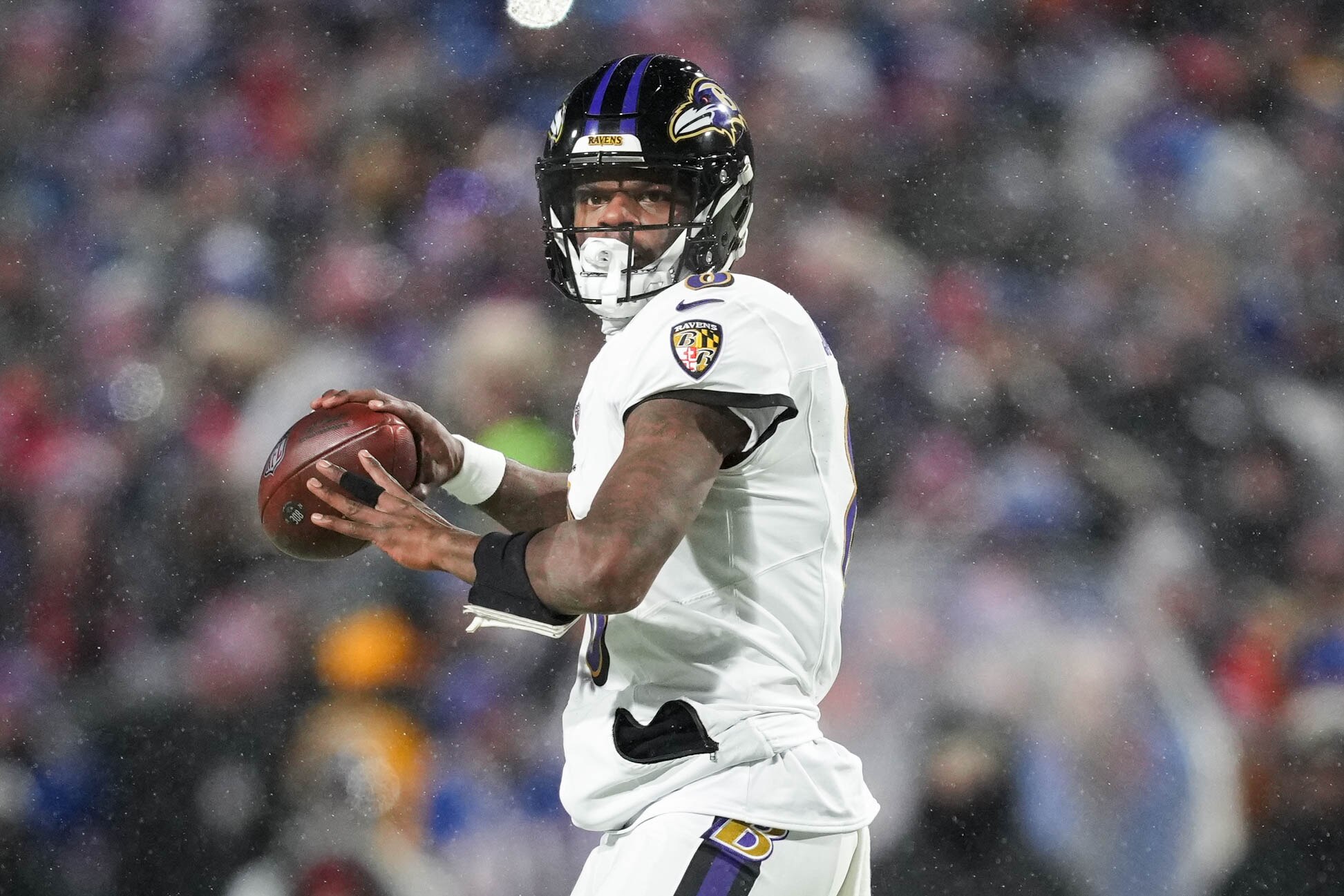 Baltimore Ravens quarterback Lamar Jackson (8) drops back to throw a pass against the Buffalo Bills in a divisional round playoff game at Highmark Stadium in Orchard Park, NY. on Sunday, January 19, 2025.